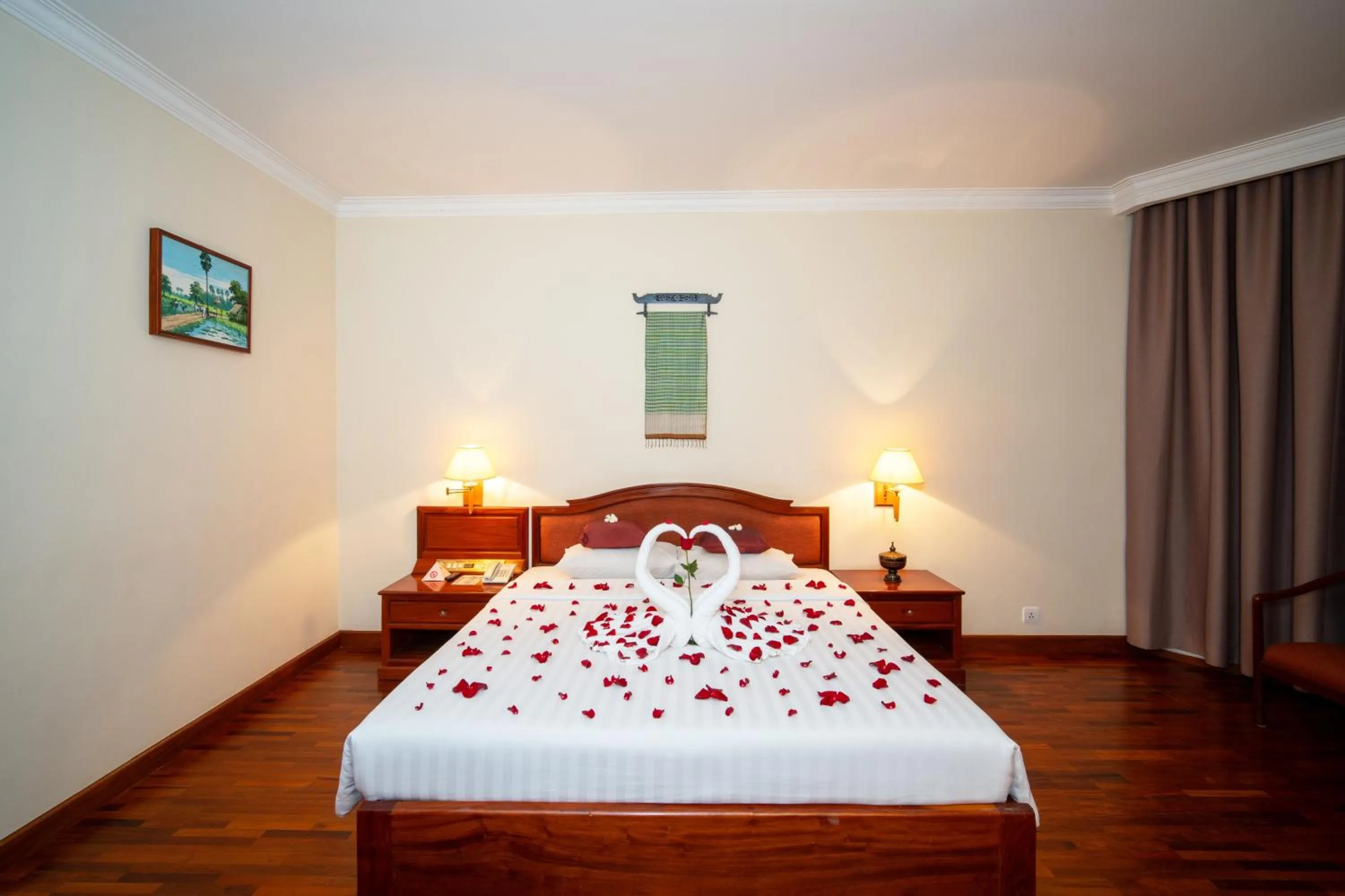 Bed in Khemara Angkor Hotel & Spa