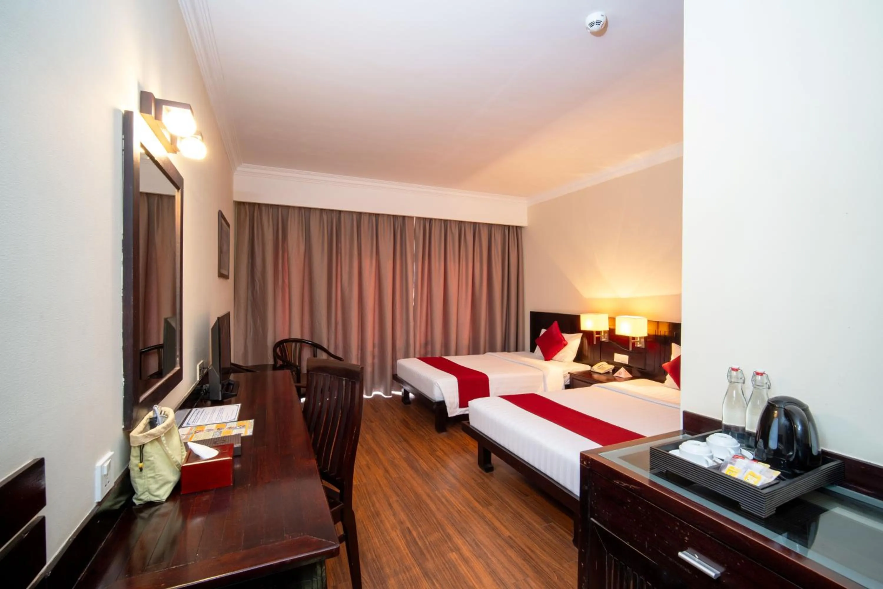 Bed in Khemara Angkor Hotel & Spa