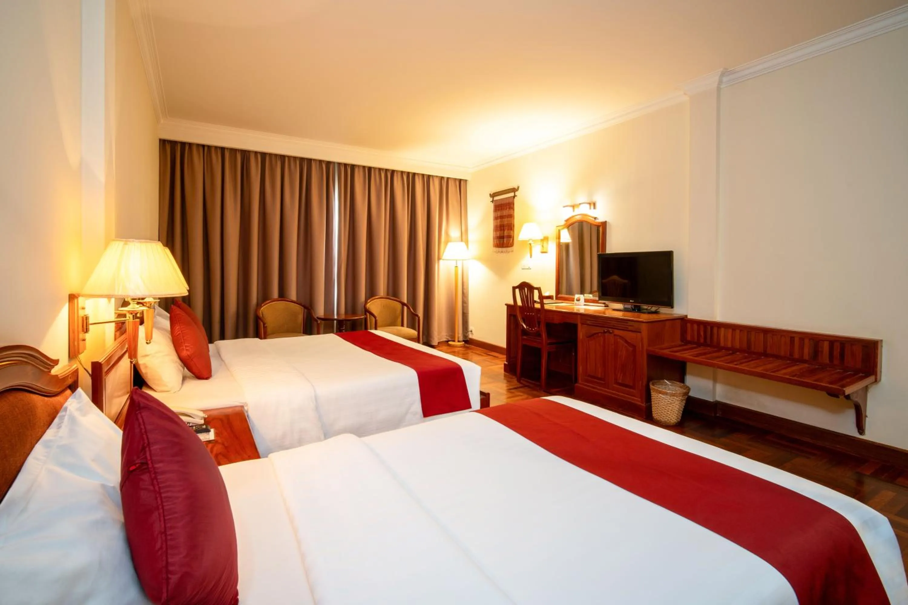 Bed in Khemara Angkor Hotel & Spa