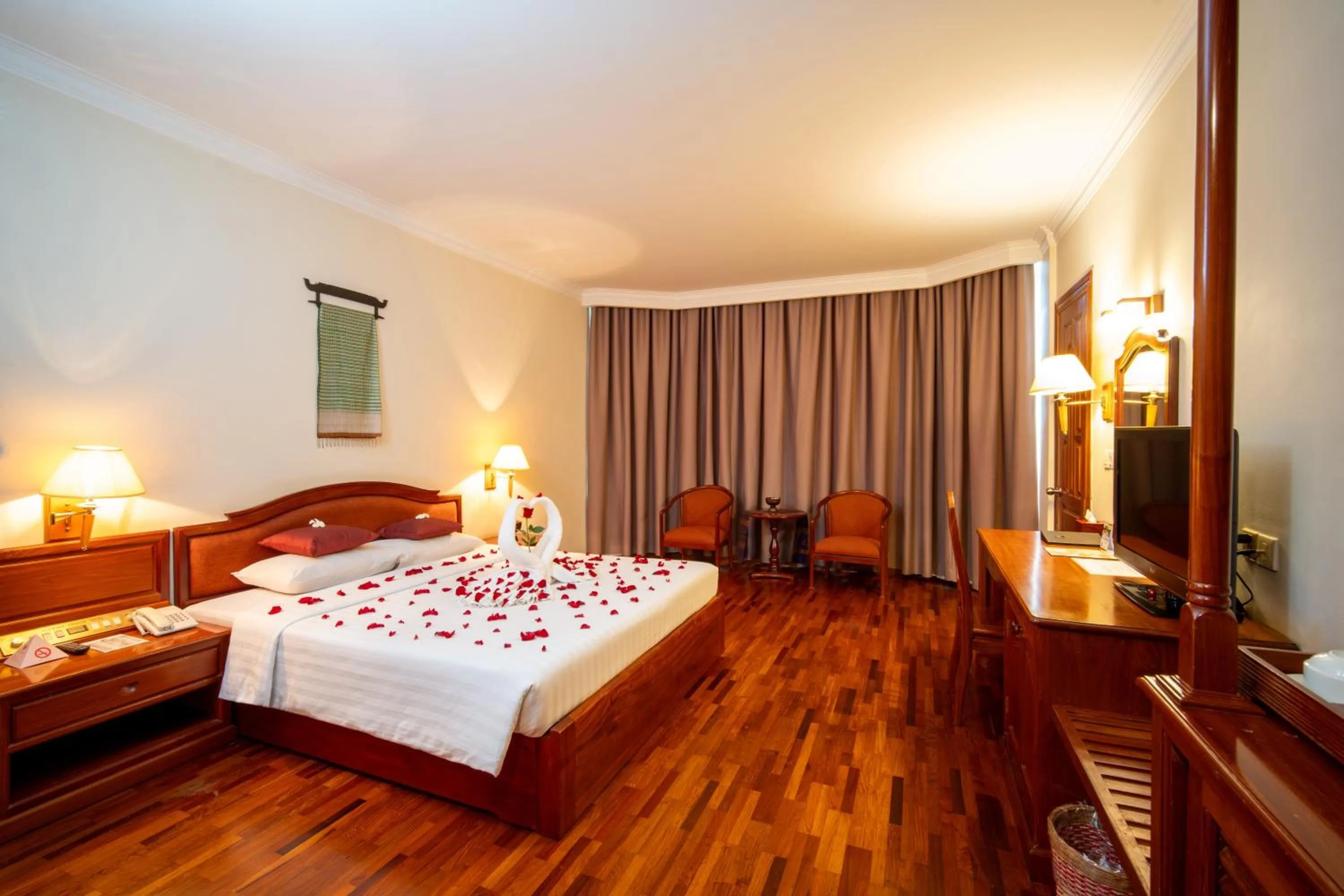 Bed in Khemara Angkor Hotel & Spa