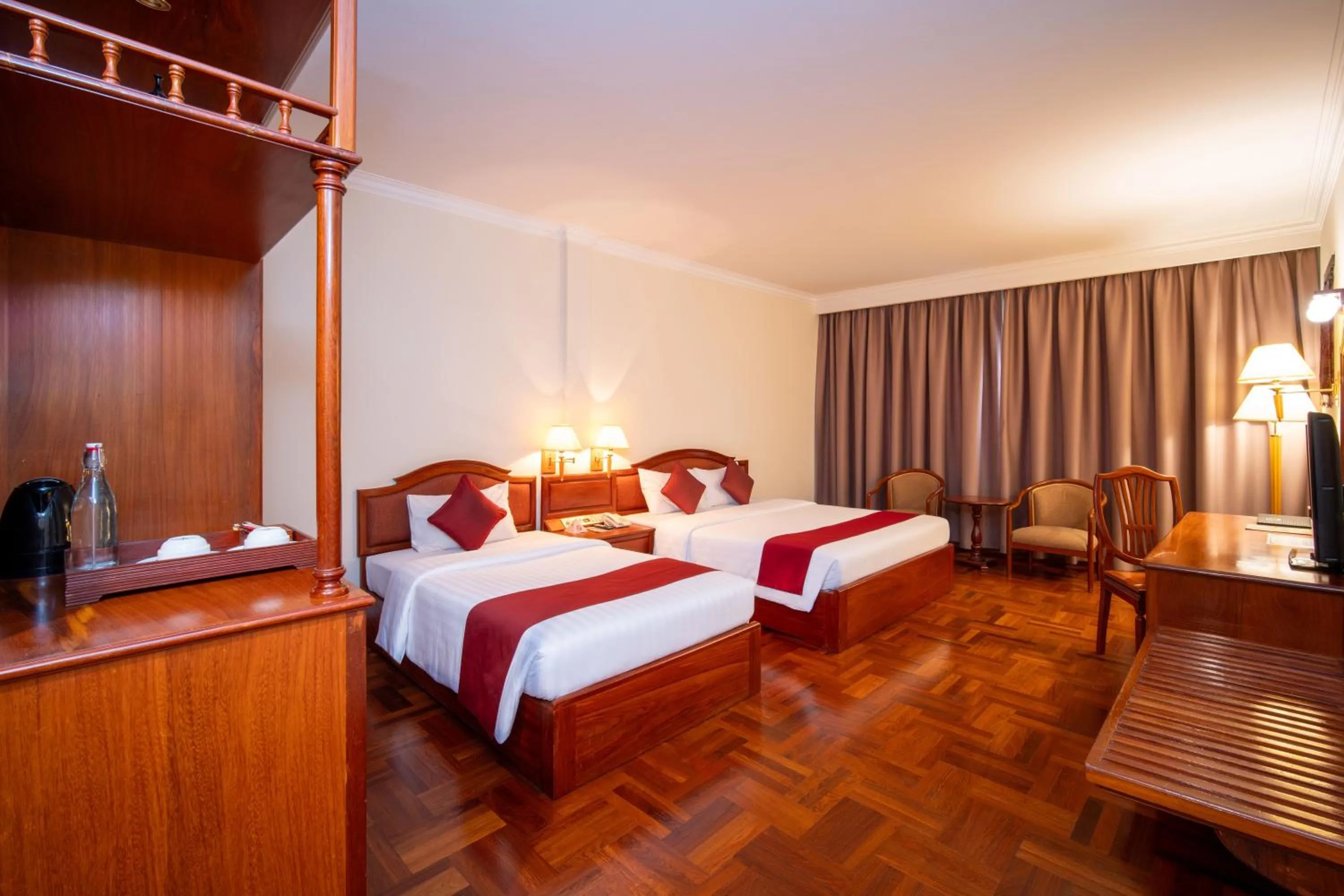 Bed in Khemara Angkor Hotel & Spa