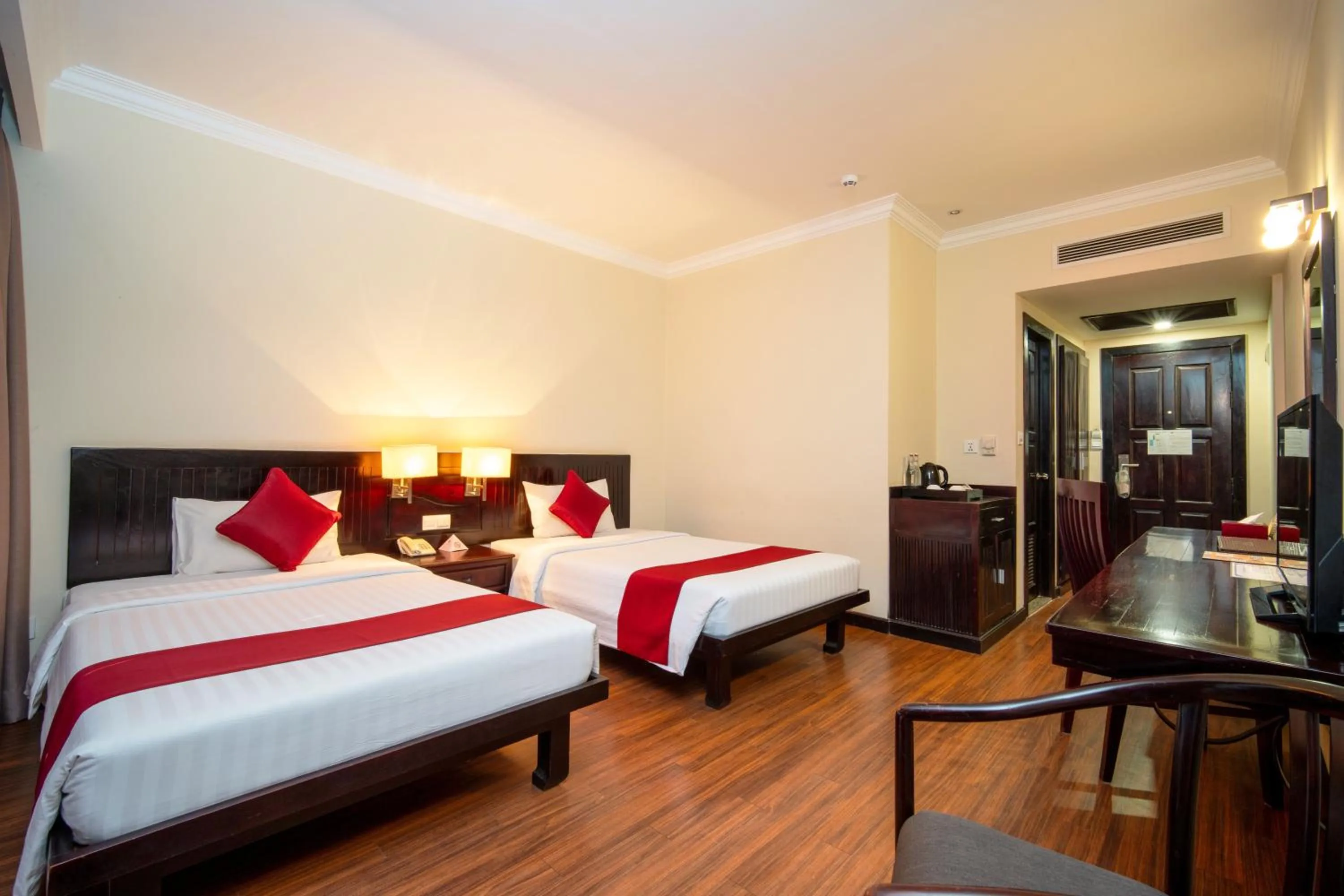 Bed in Khemara Angkor Hotel & Spa