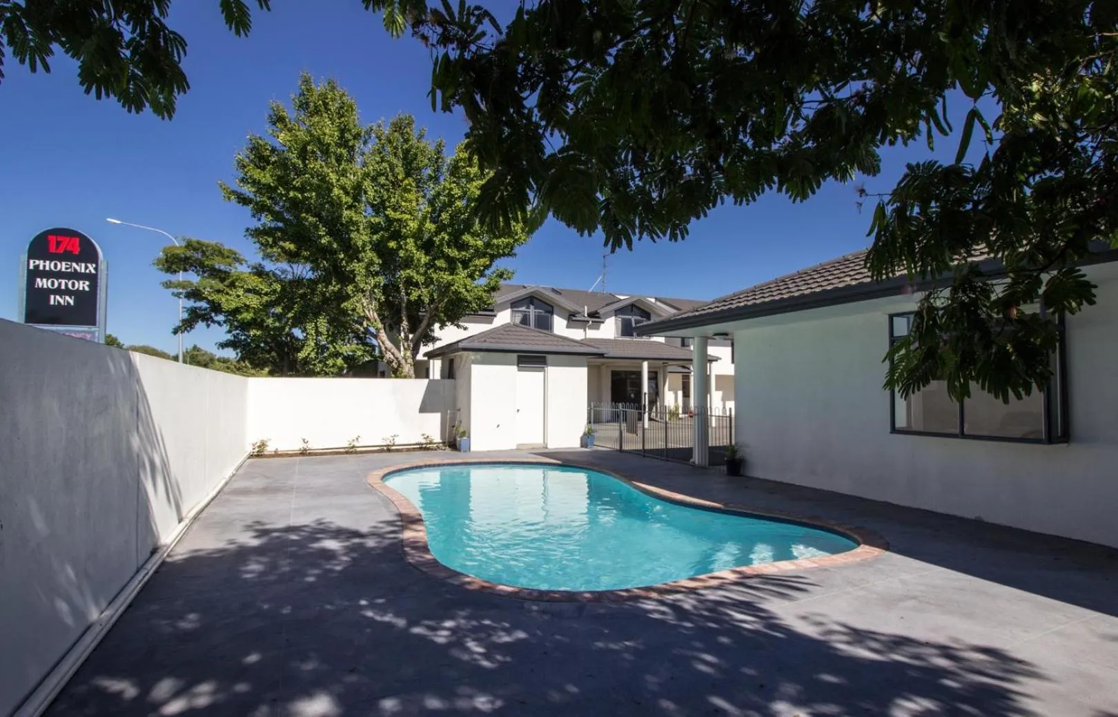 Swimming pool in ASURE Phoenix Motor Inn