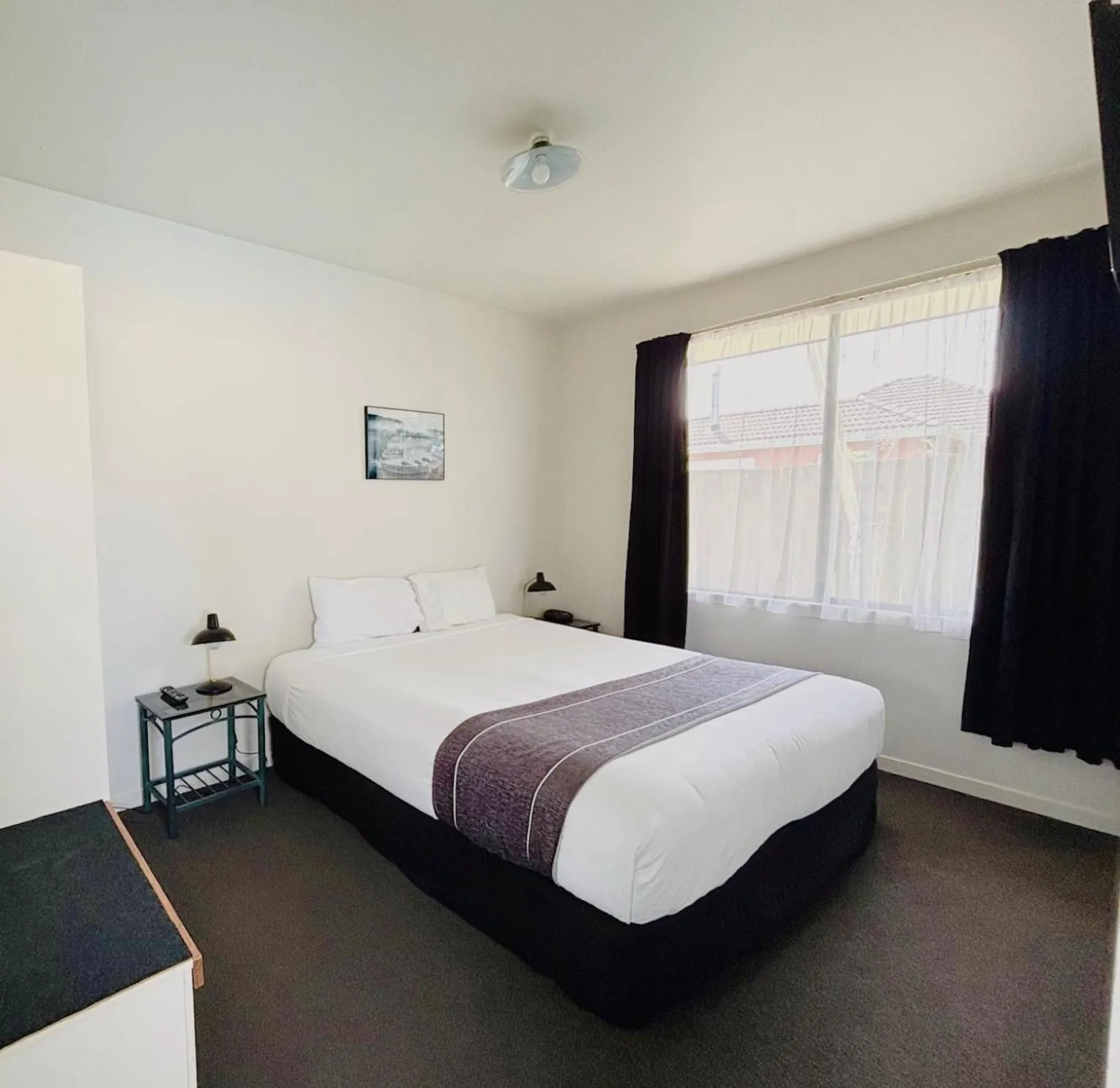 Bed in ASURE Phoenix Motor Inn