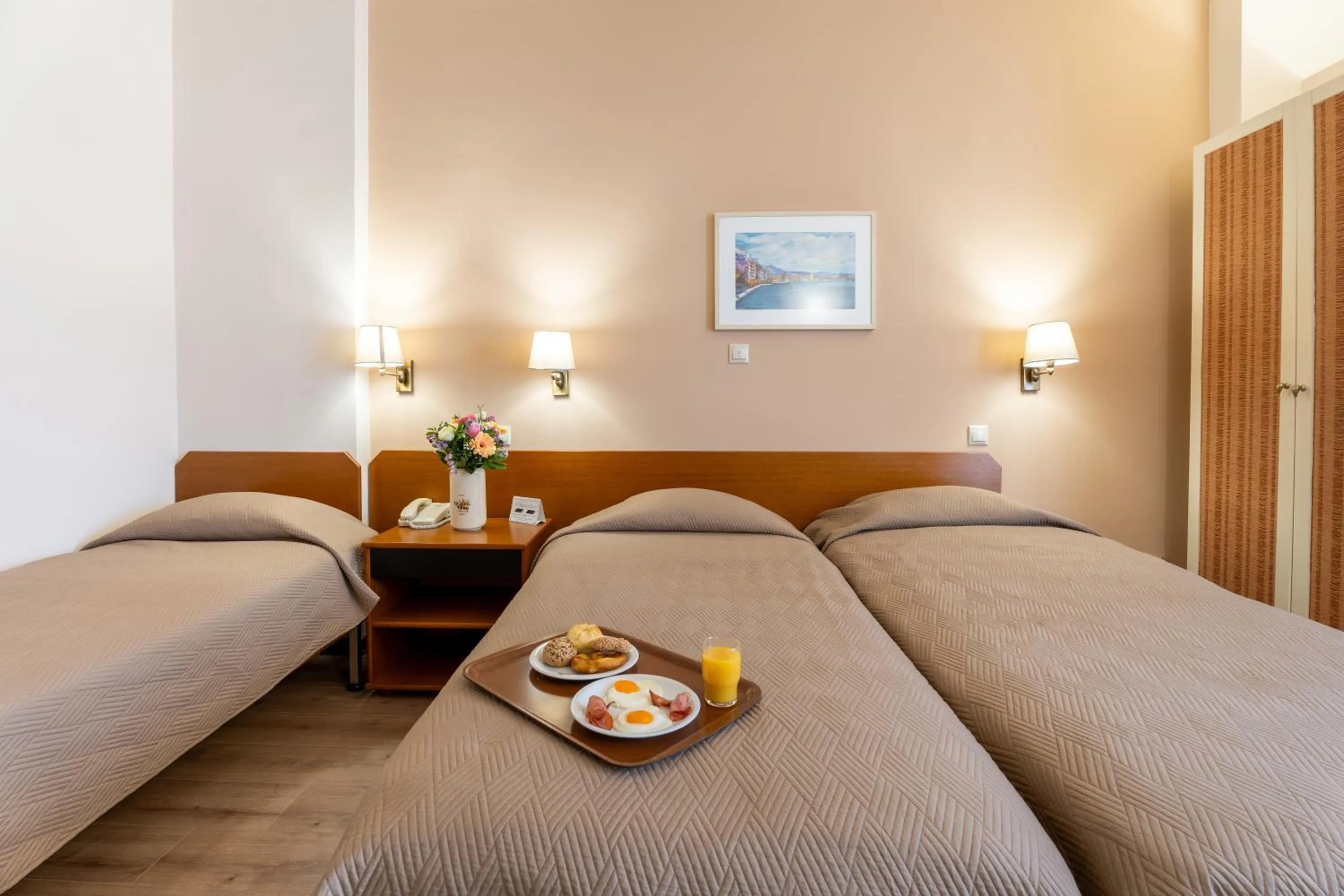 Bed in Queen Olga Hotel