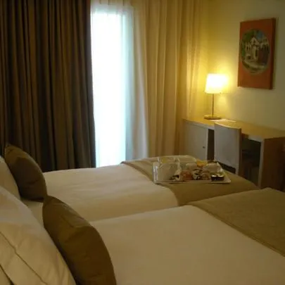 Bed in INLIMA Hotel & Spa