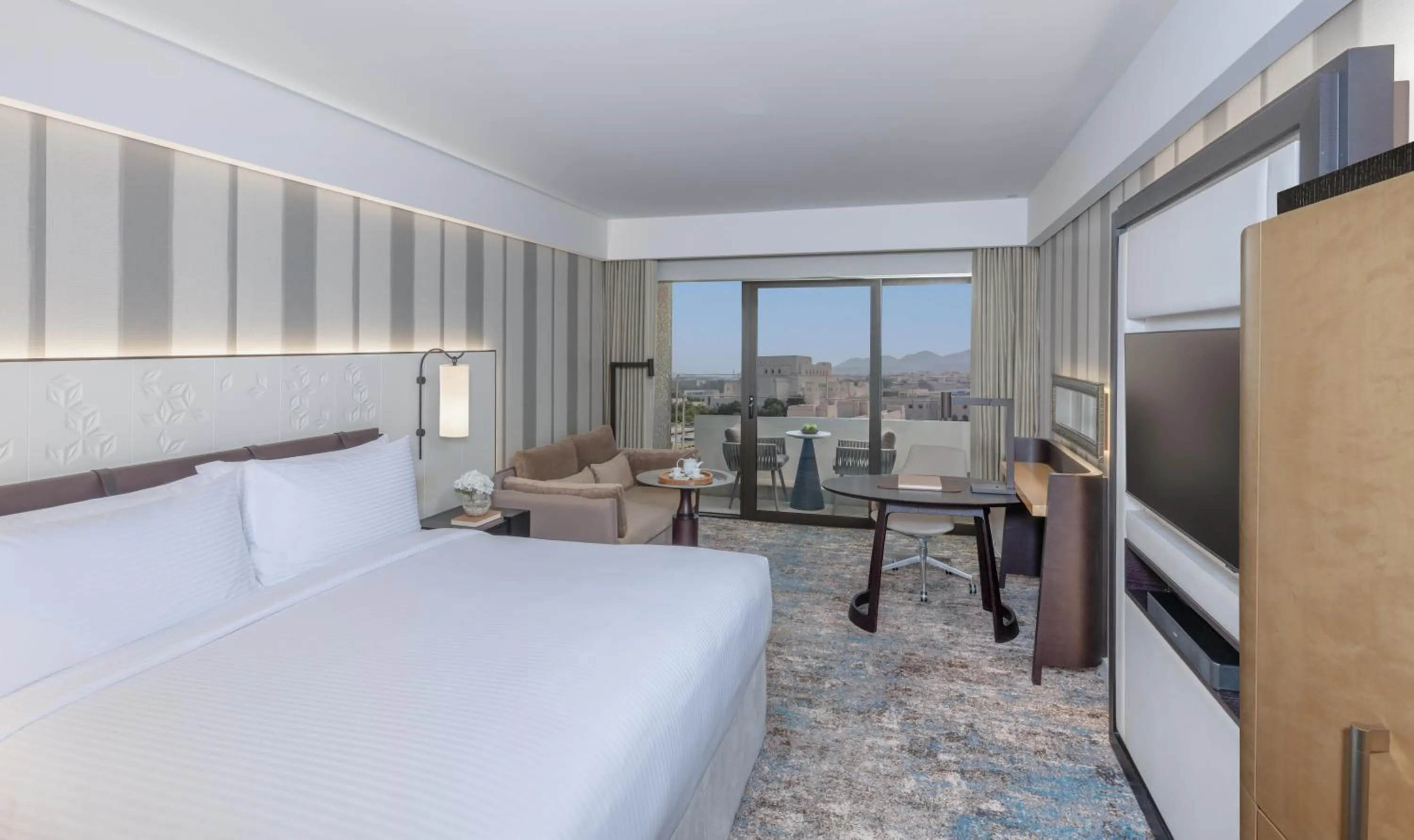 Communal lounge/ TV room, Bed in InterContinental Muscat by IHG