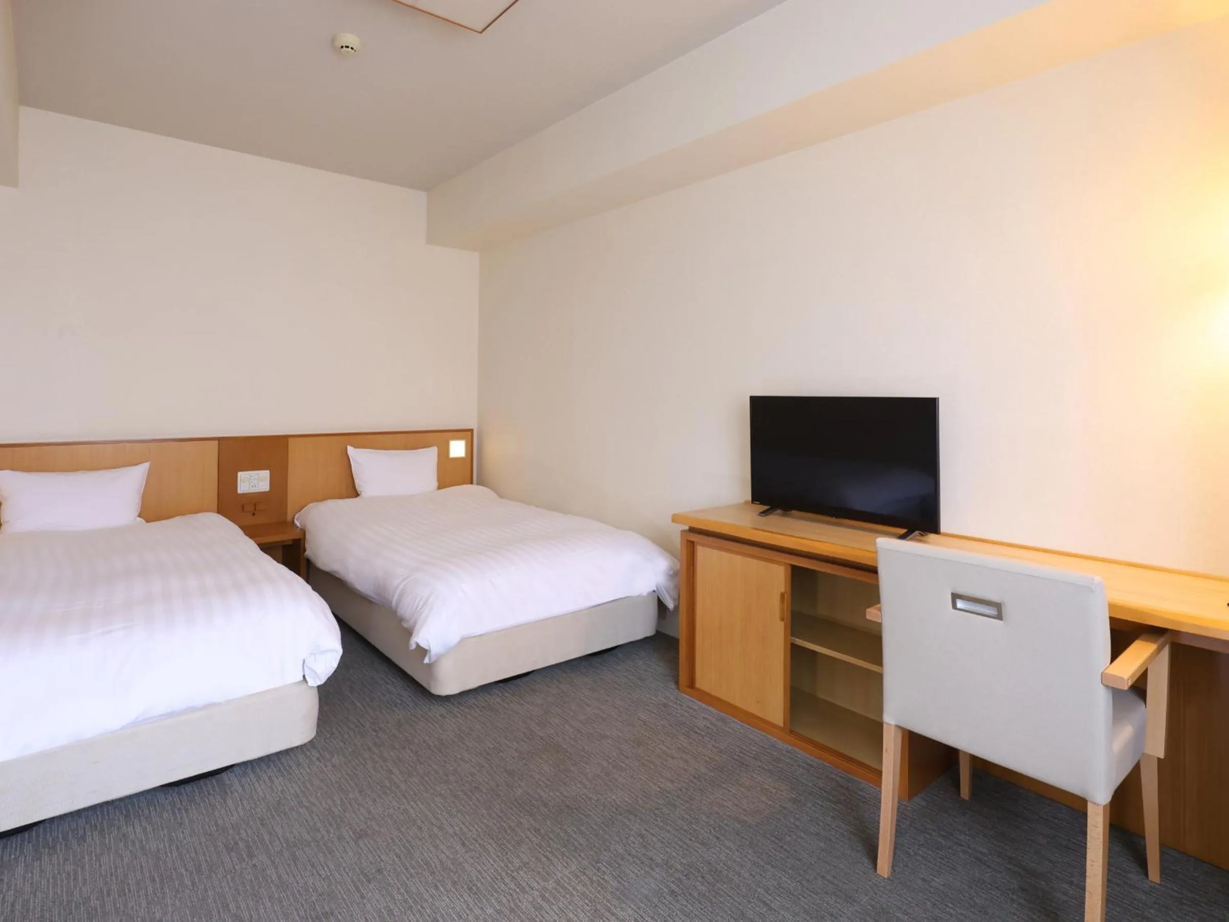 Bed in Dormy Inn Tsu