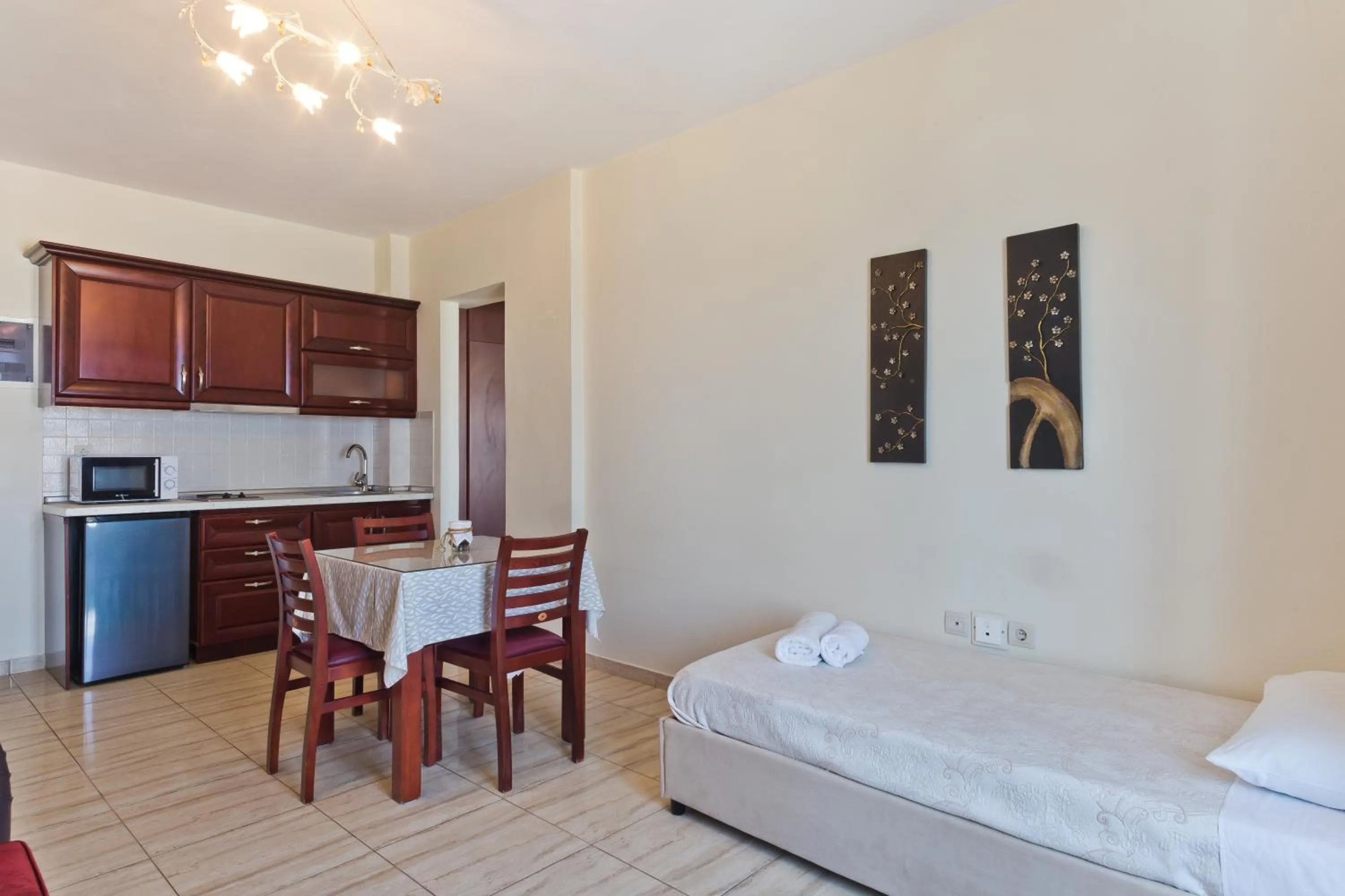 Kitchen or kitchenette, Bed in Arkasa Bay Hotel