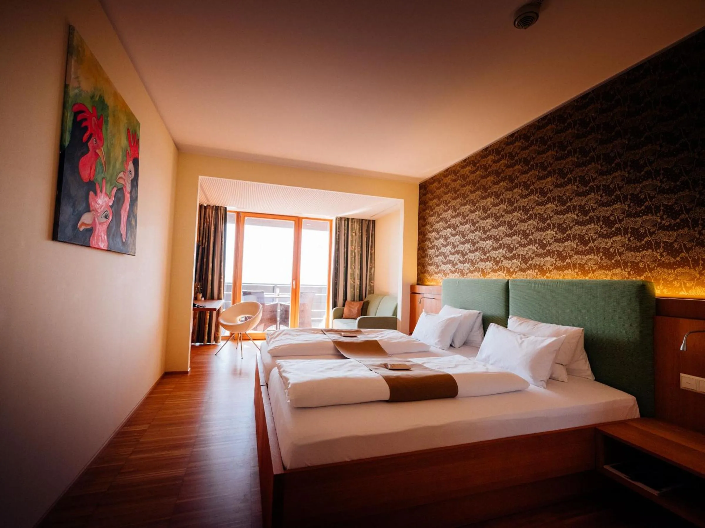 Photo of the whole room, Bed in Genusshotel Riegersburg