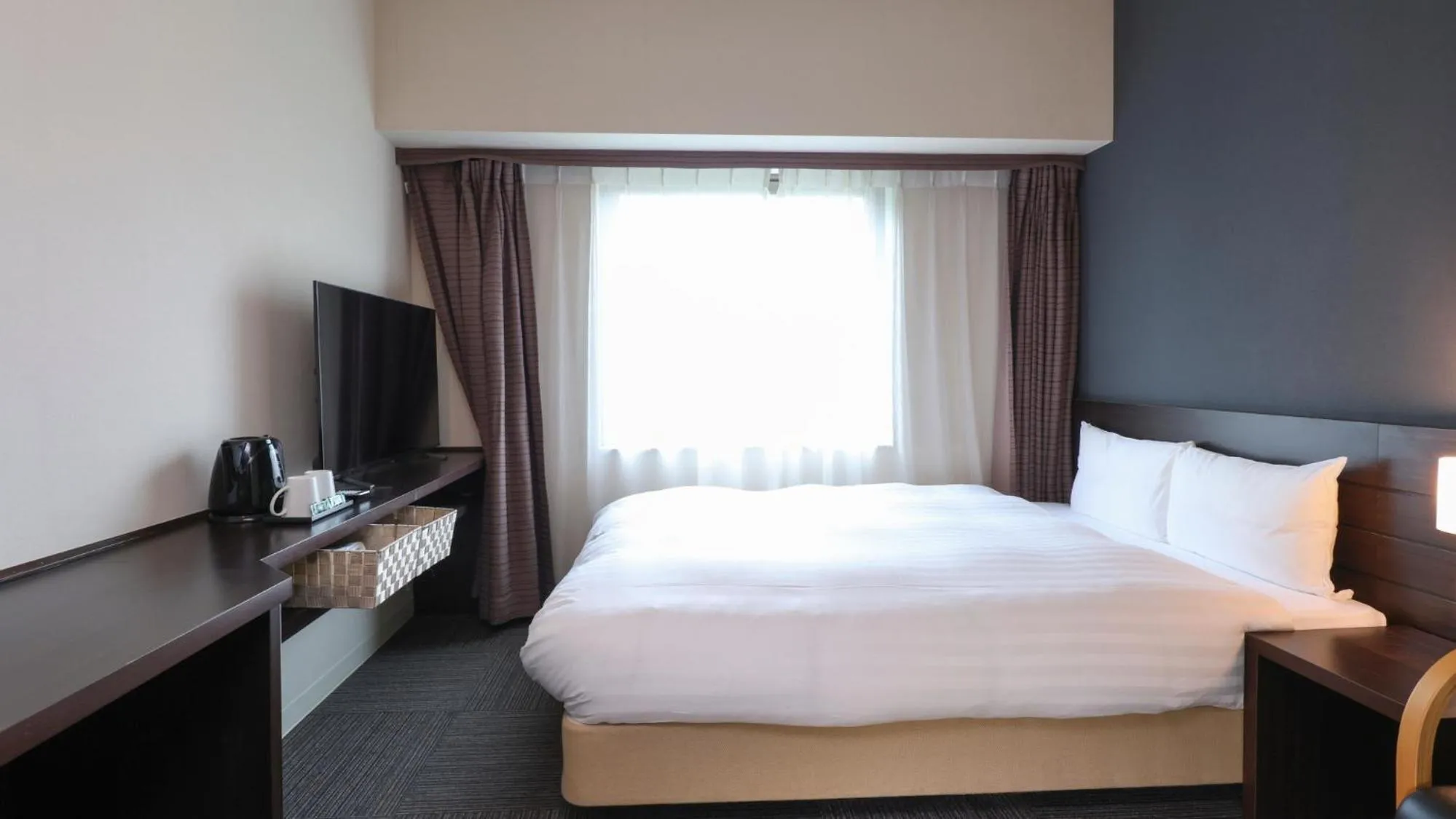 Bed in Dormy Inn Sendai Annex