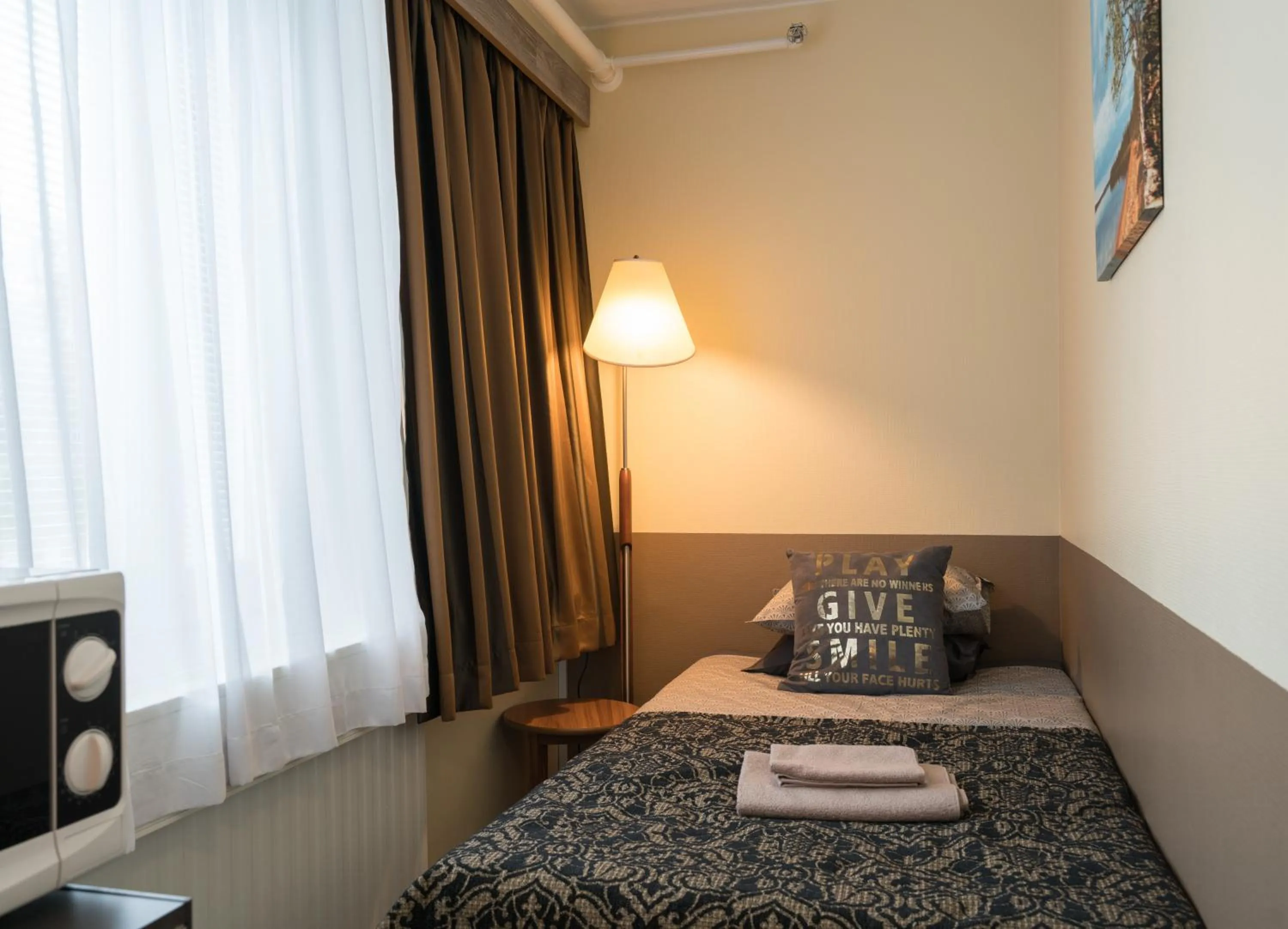 Photo of the whole room, Bed in Gasthaus Patruuna