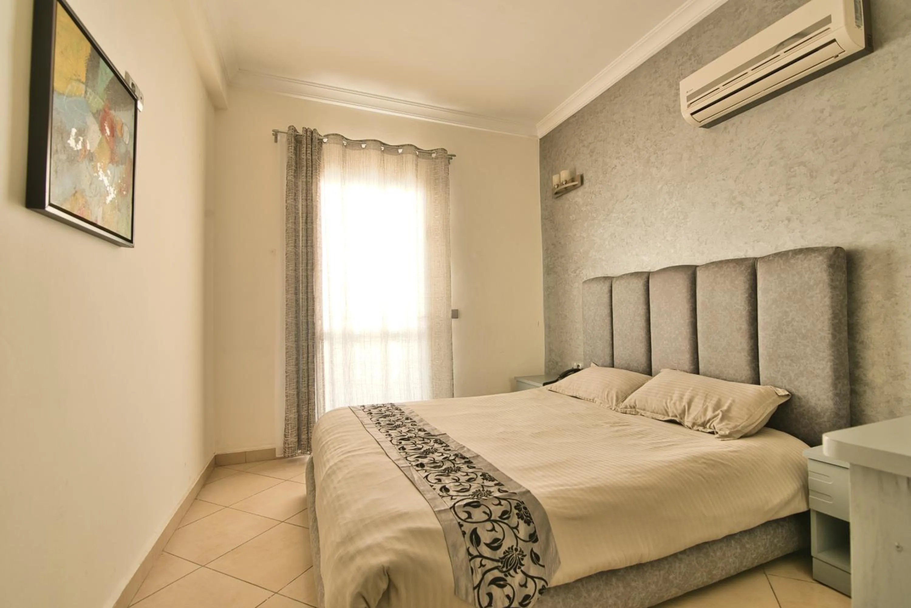 Bedroom, Bed in Appart Hôtel Founty Beach