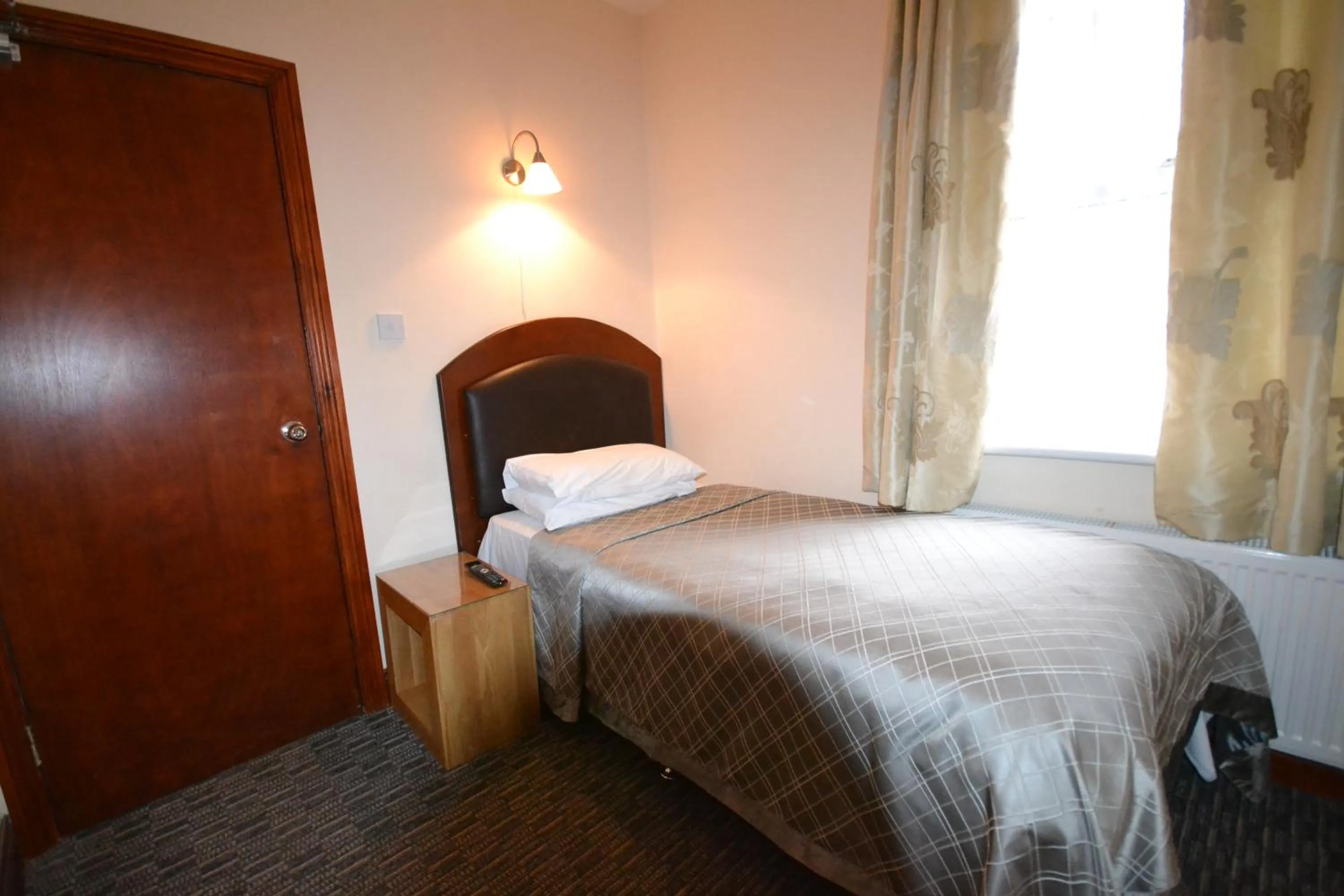 Bed in Airport Guest House