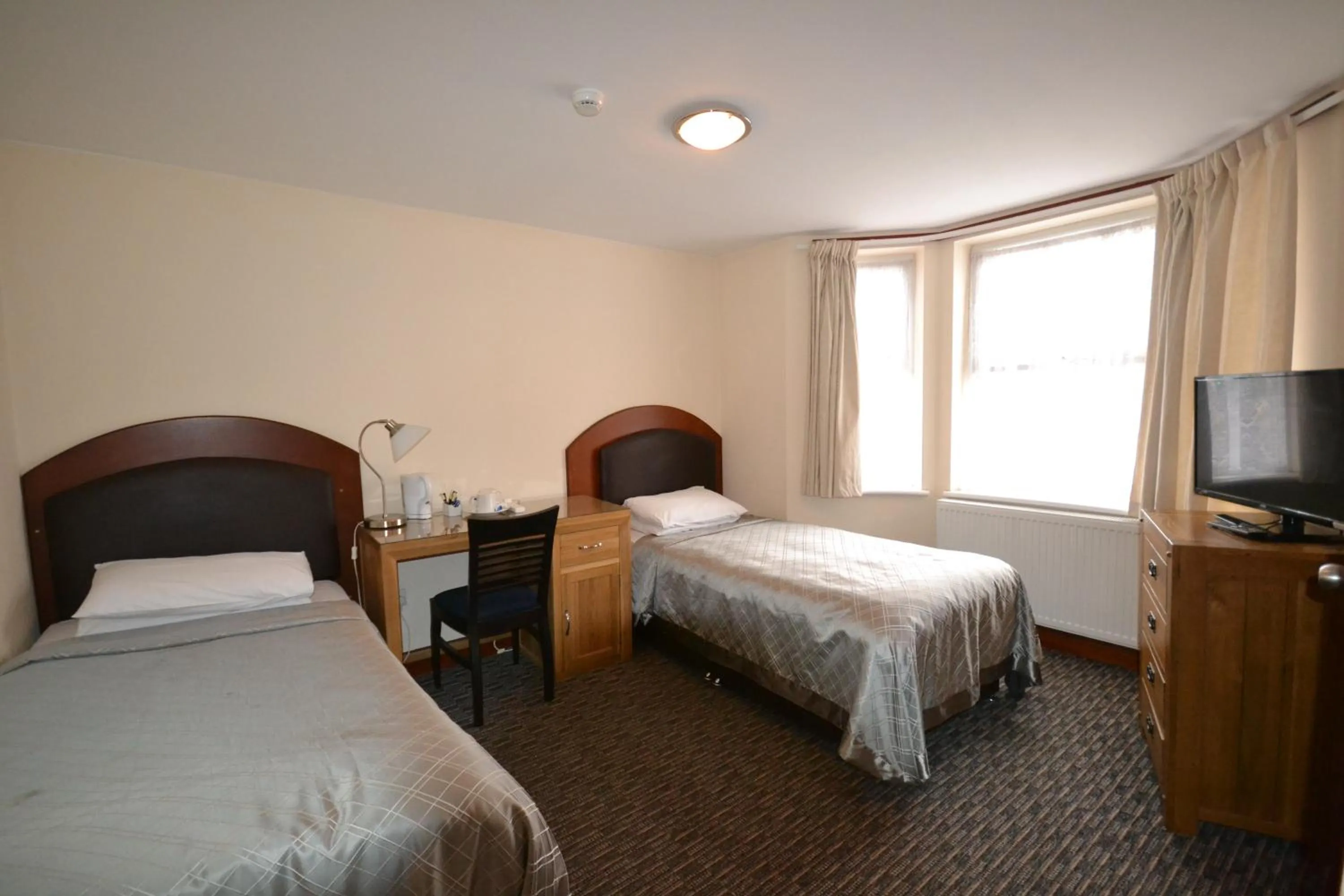 Bed in Airport Guest House