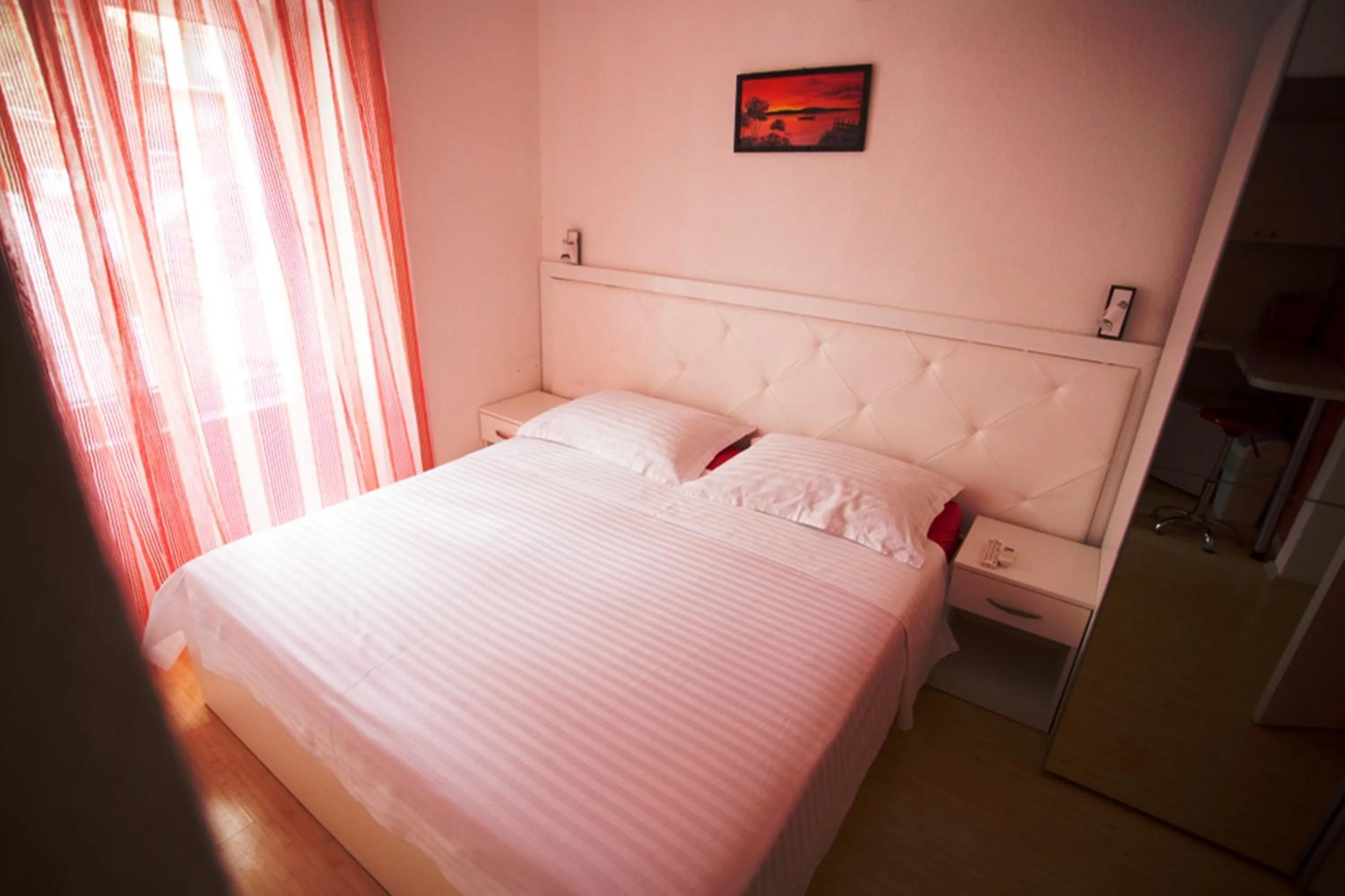 Bed in Nirvana Rooms & Apartments