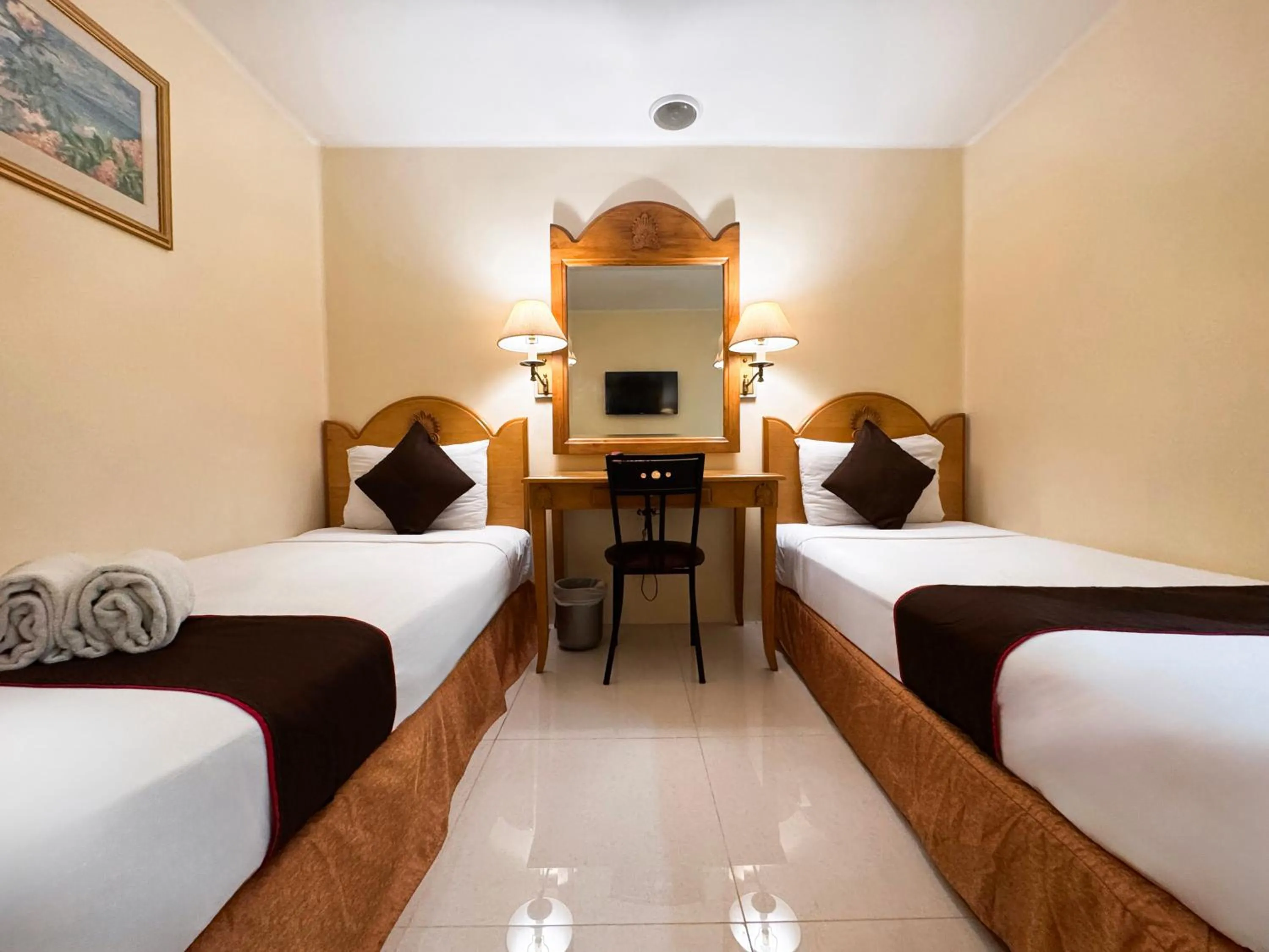 Bed in Palladium Suites Hotel