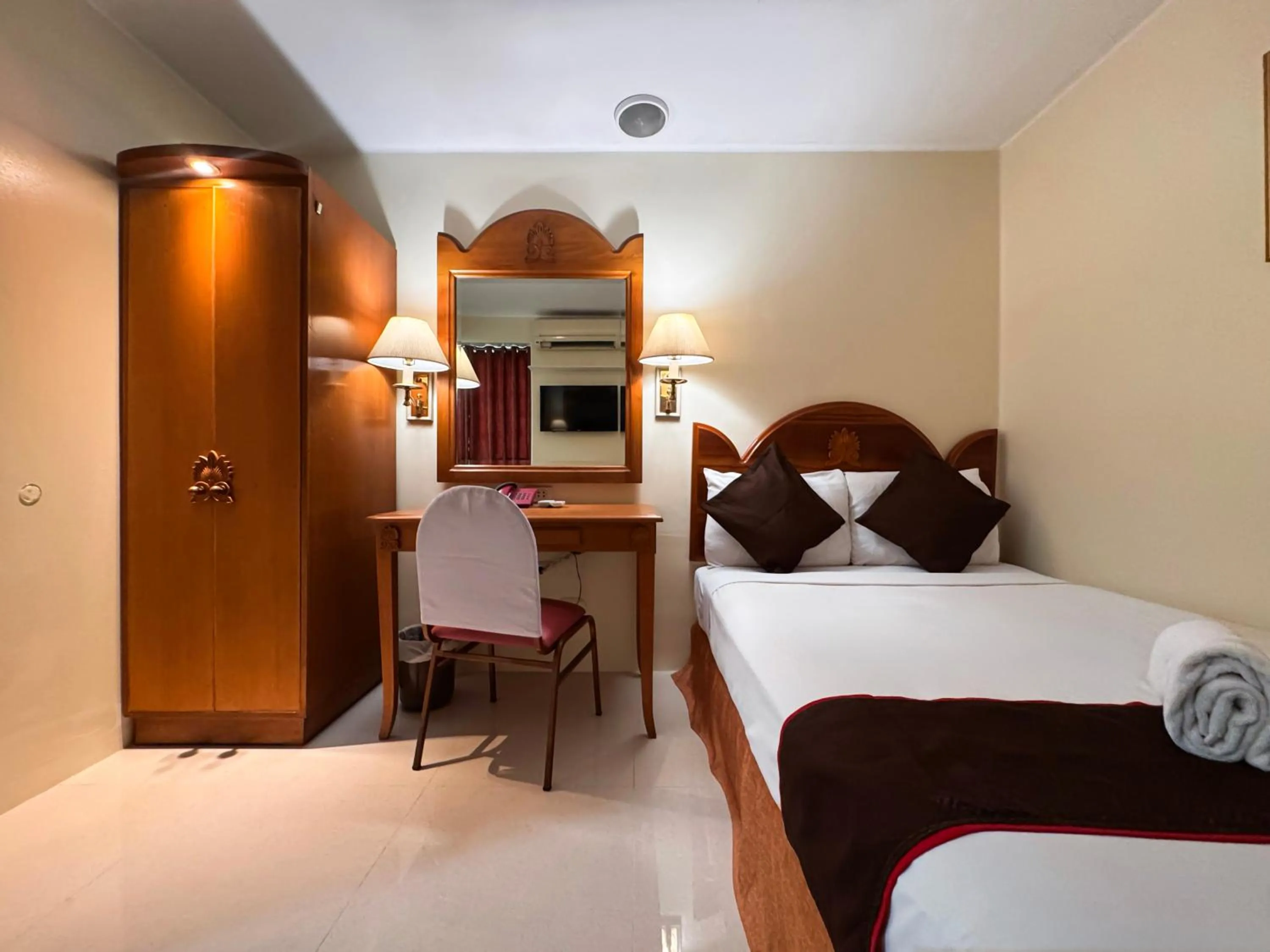 Bed in Palladium Suites Hotel