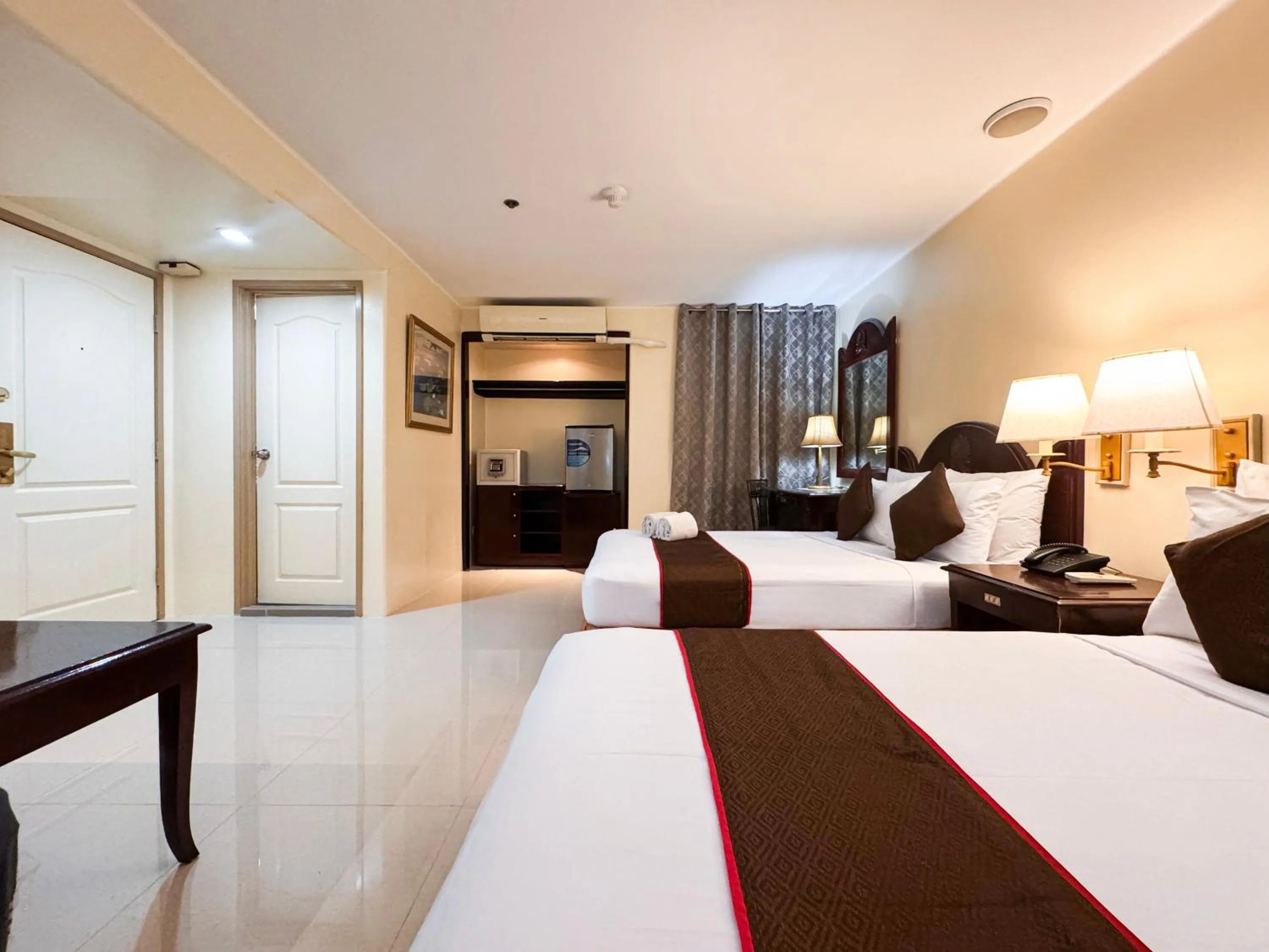 Bed in Palladium Suites Hotel