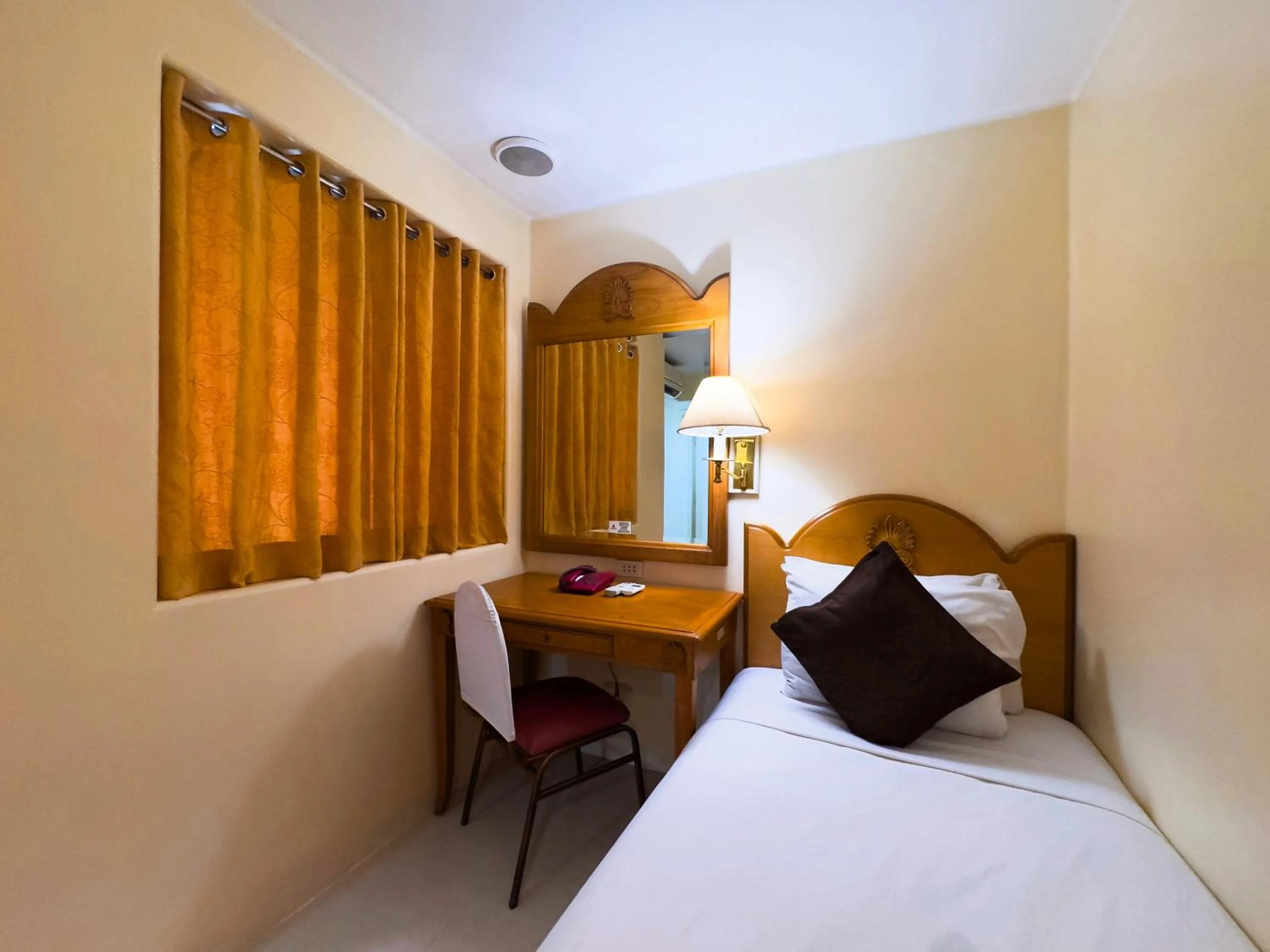 Bed in Palladium Suites Hotel