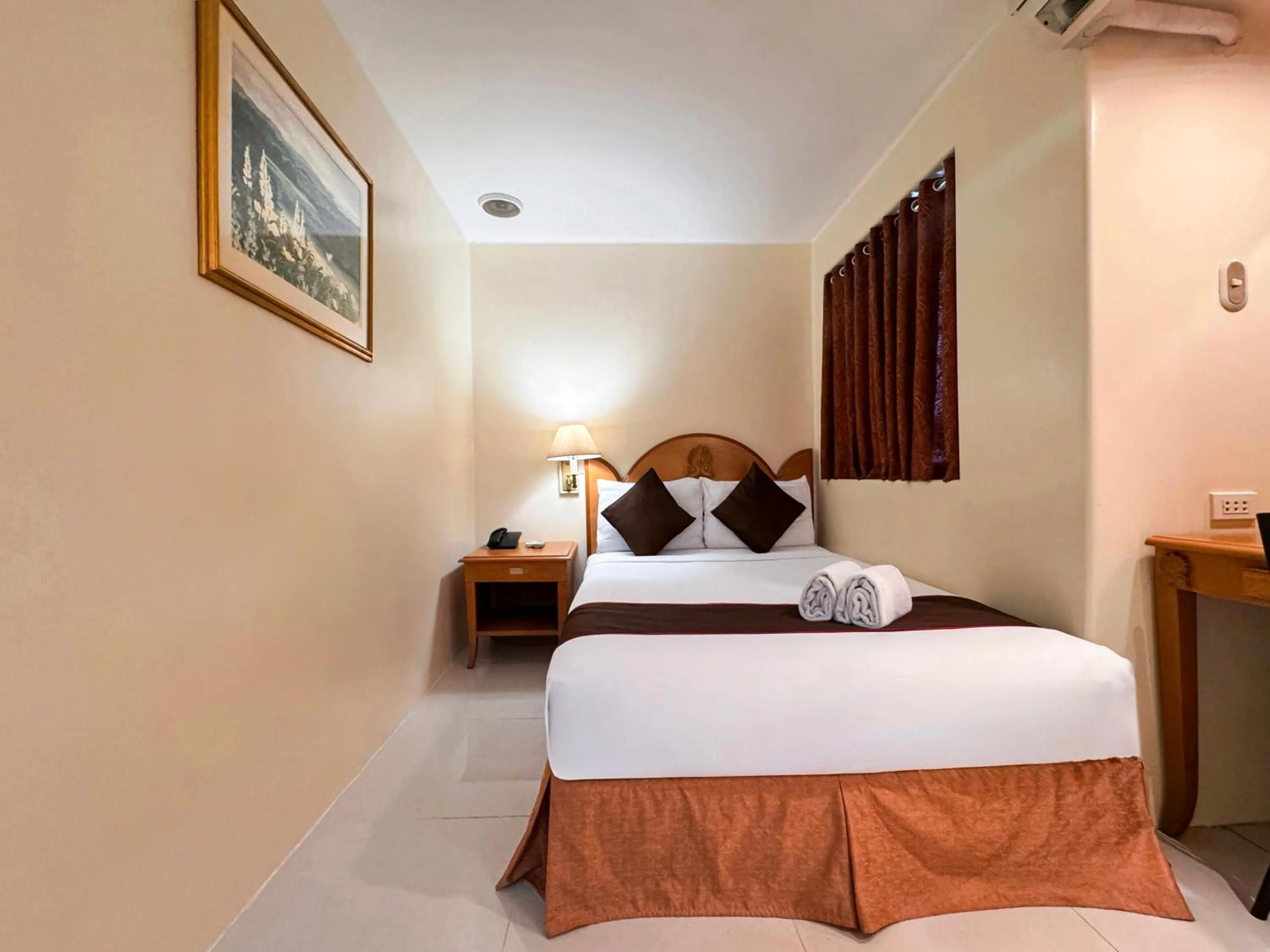 Bed in Palladium Suites Hotel