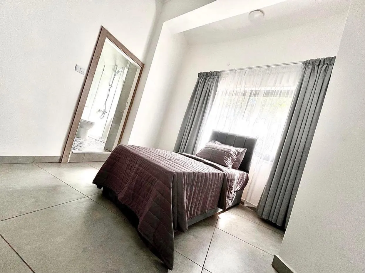 Bed in Jordan Tower Hotel