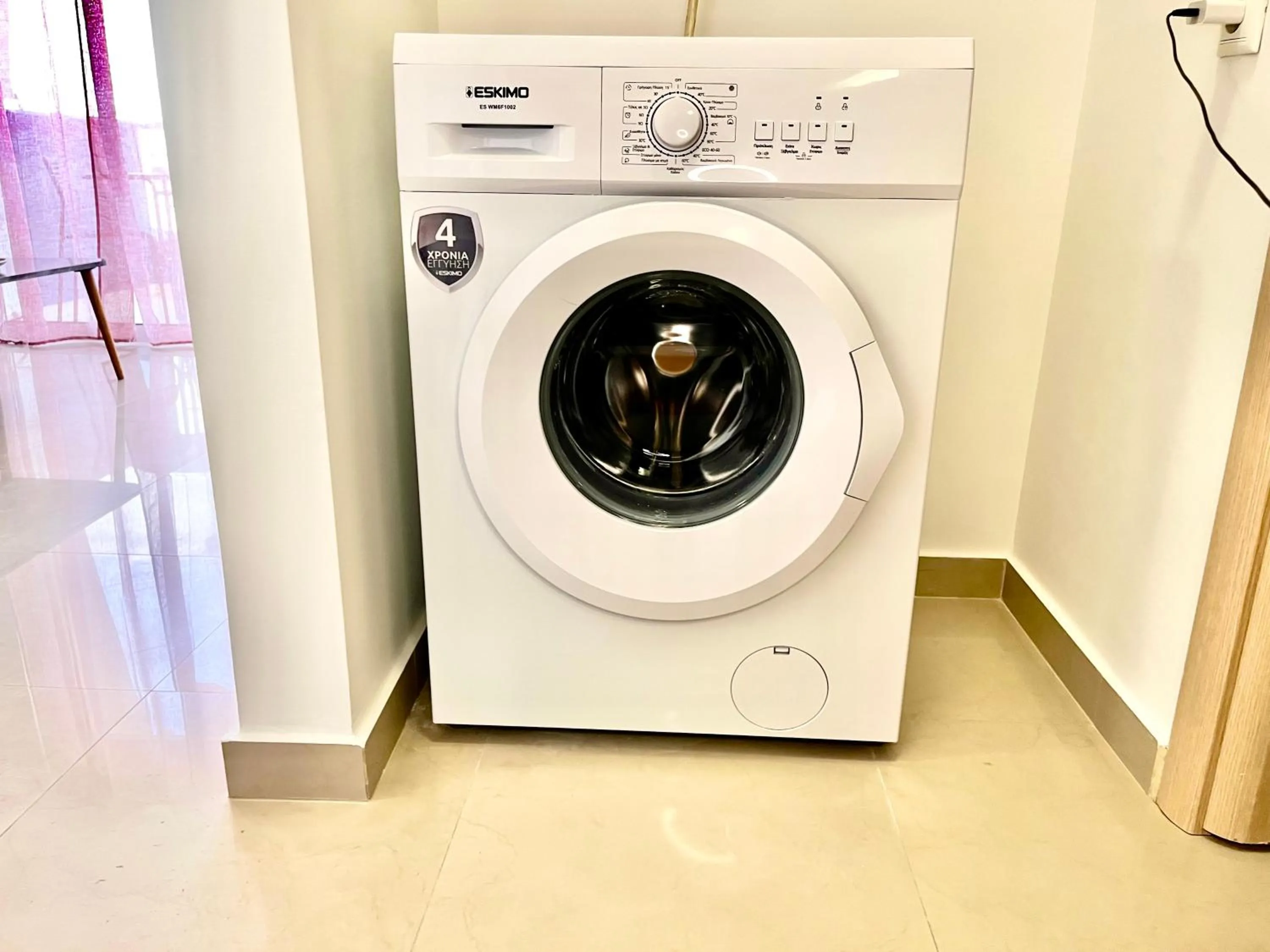 washing machine in Elvita Apartments 2