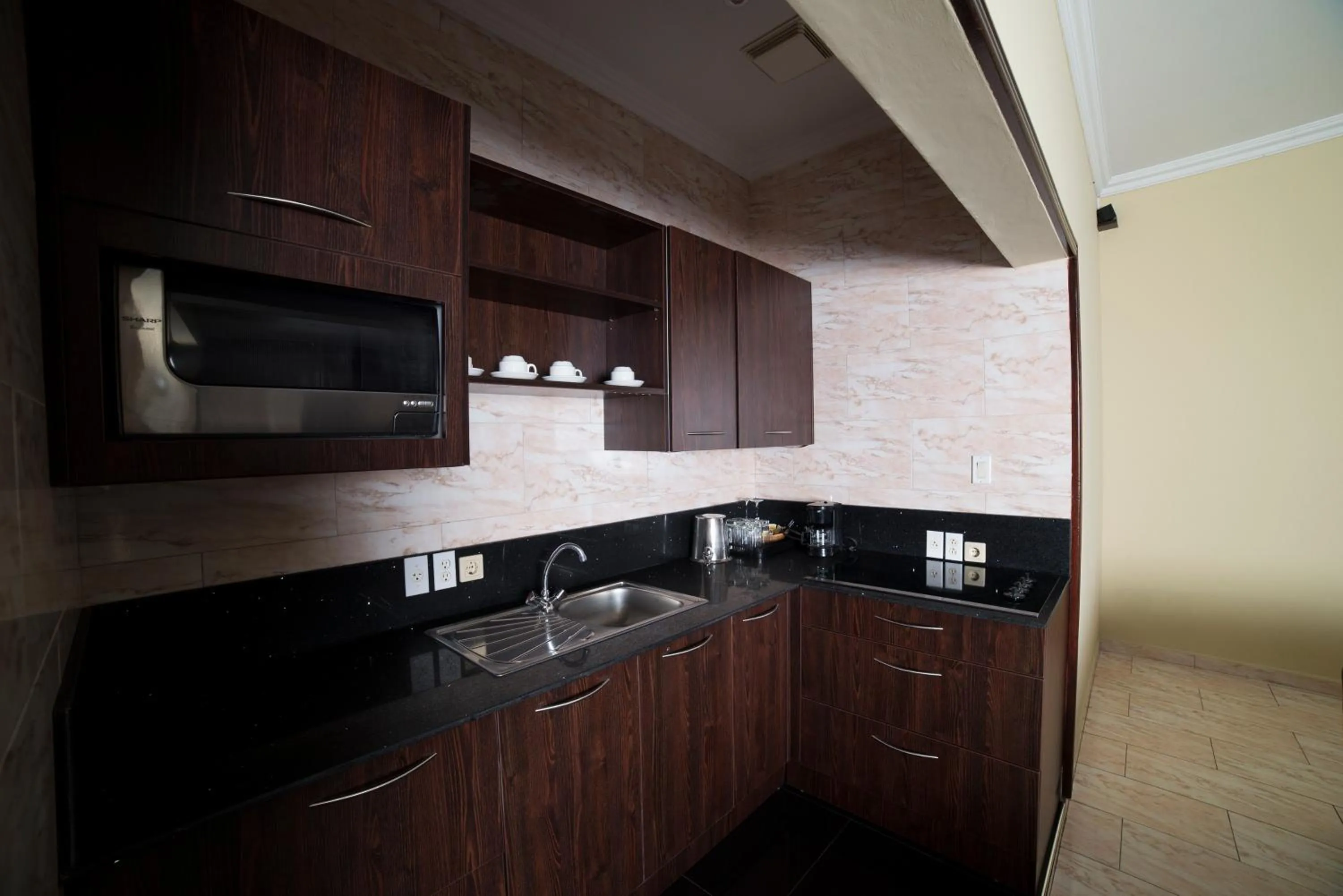 Kitchen or kitchenette in Hotel Elegance NV