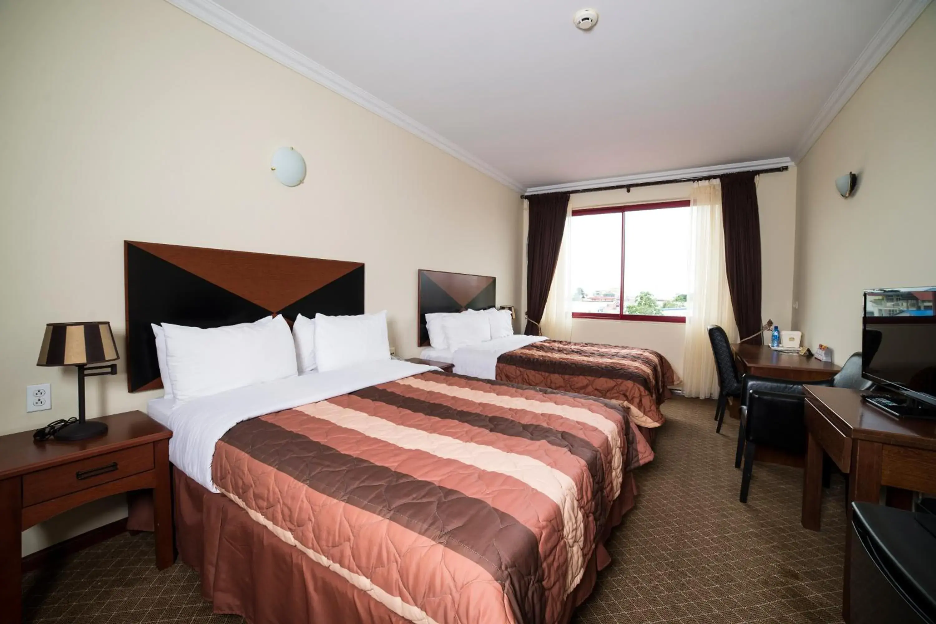 Deluxe Double Room (2 Adults + 1 Child) - single occupancy in Hotel Elegance NV Deluxe Double Room (2 Adults + 1 Child) - single occupancy in Hotel Elegance NV