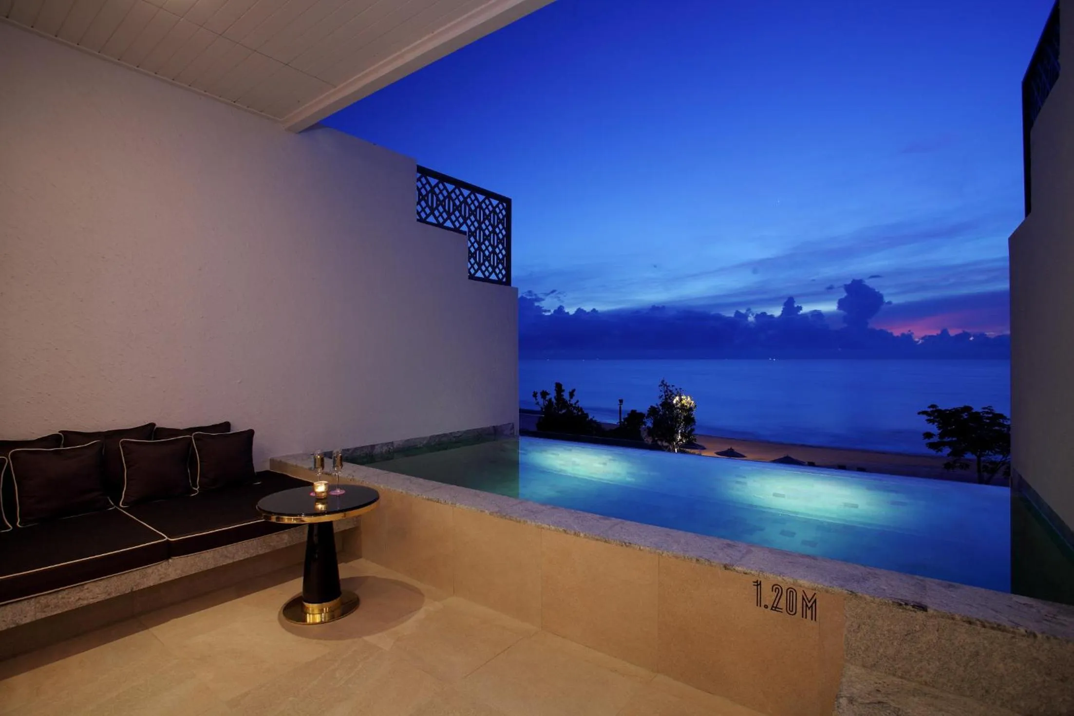 Seating area in Baba Beach Club Hua Hin Luxury Pool Villa by Sri panwa