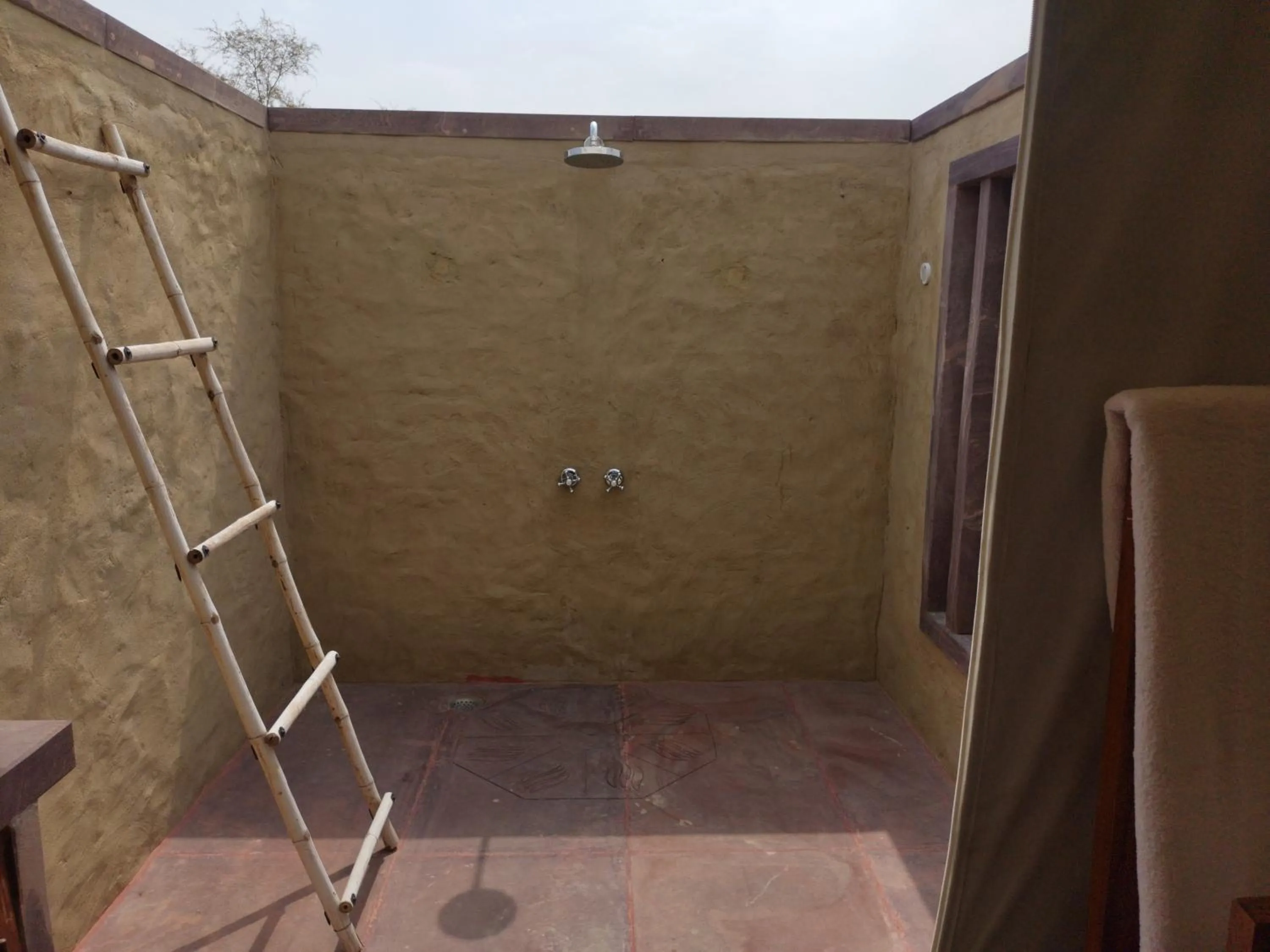 Shower in Dhora Desert Resort And Spa