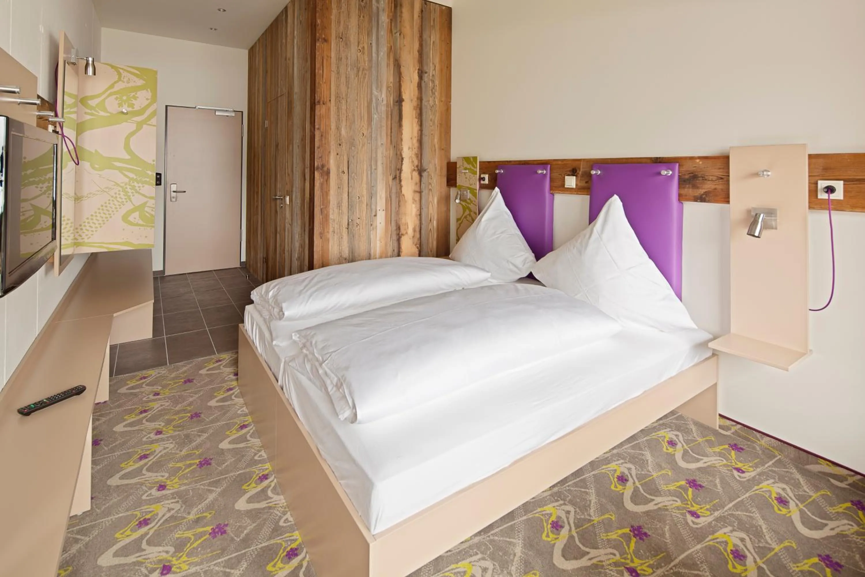 Bed in Explorer Hotel Hinterstoder