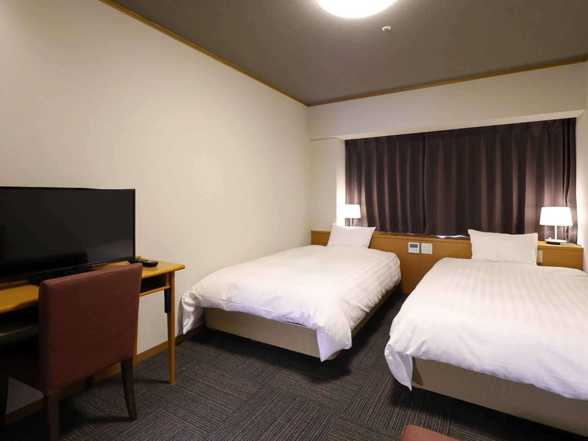 Bedroom, Bed in Dormy Inn PREMIUM Kushiro