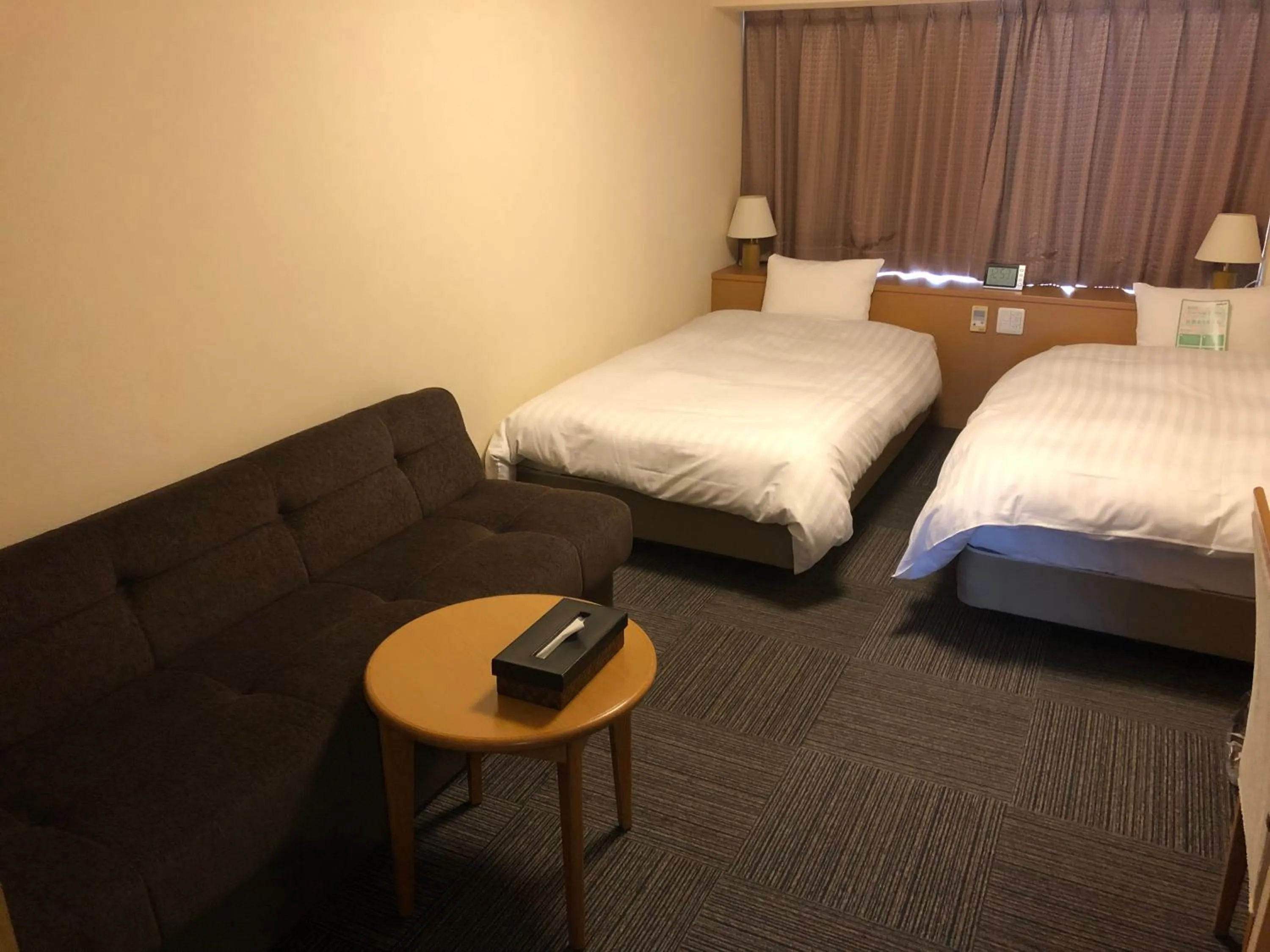 Seating area, Bed in Dormy Inn PREMIUM Kushiro