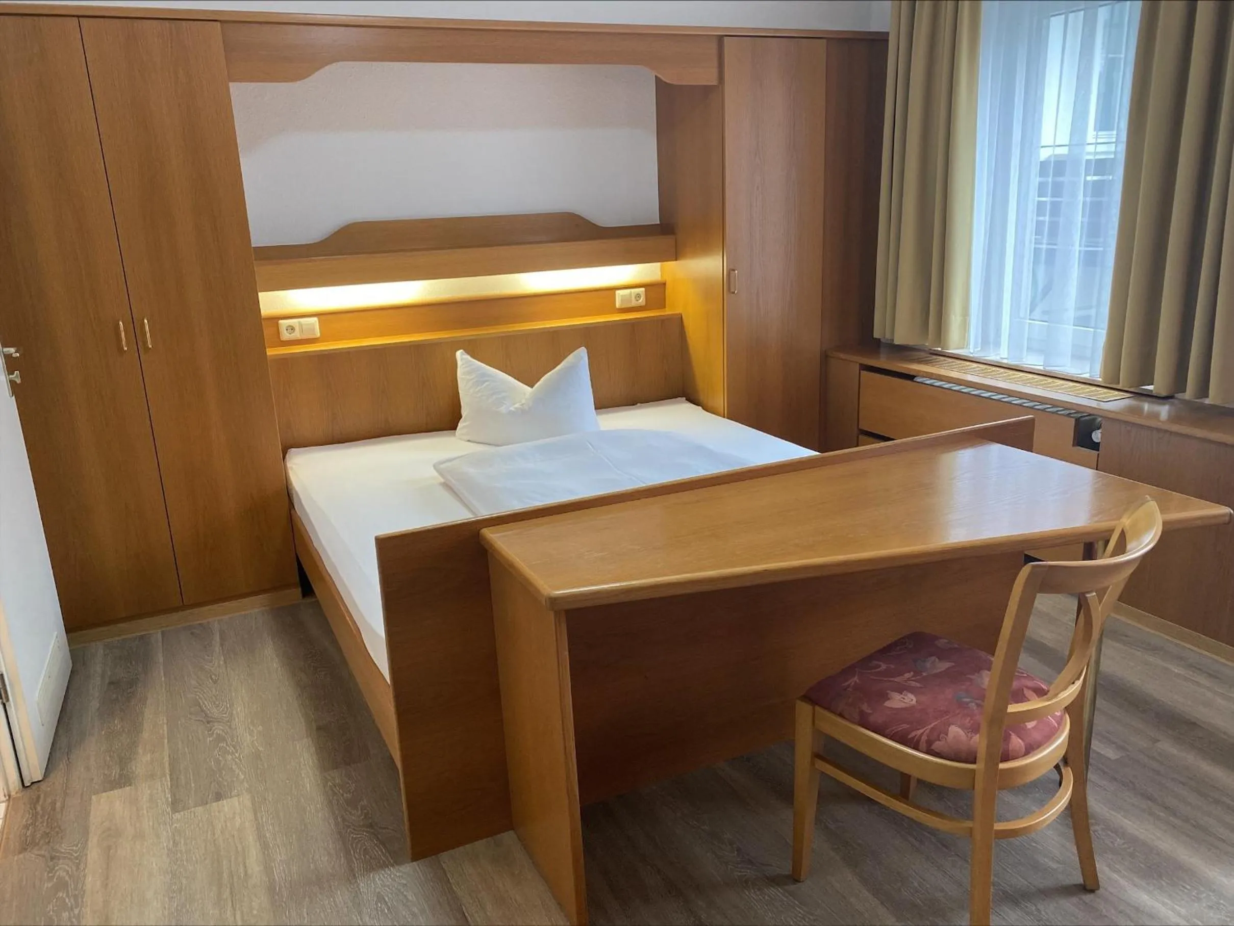 Photo of the whole room, Bed in Hotel Rosengarten Tuttlingen