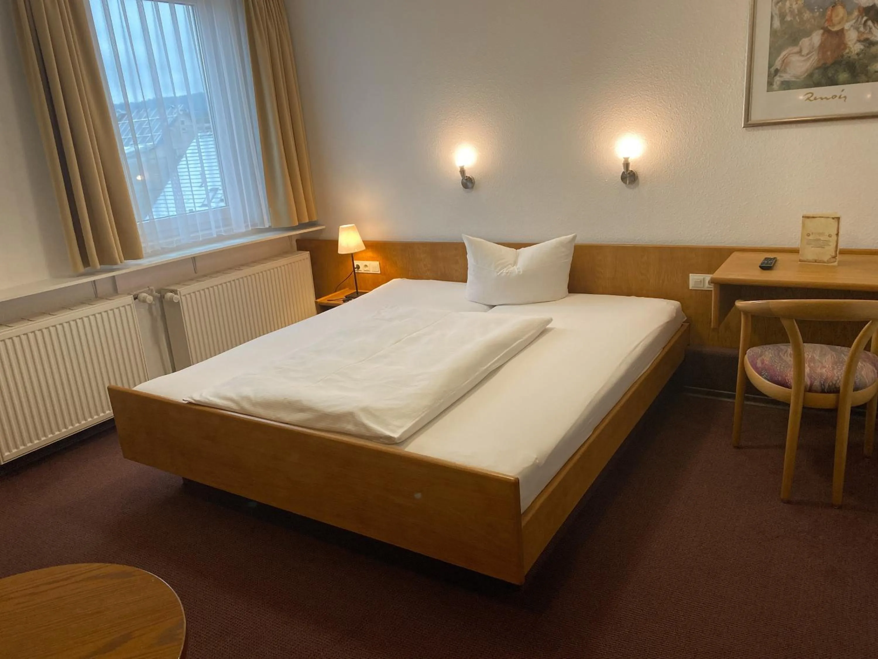Photo of the whole room, Bed in Hotel Rosengarten Tuttlingen