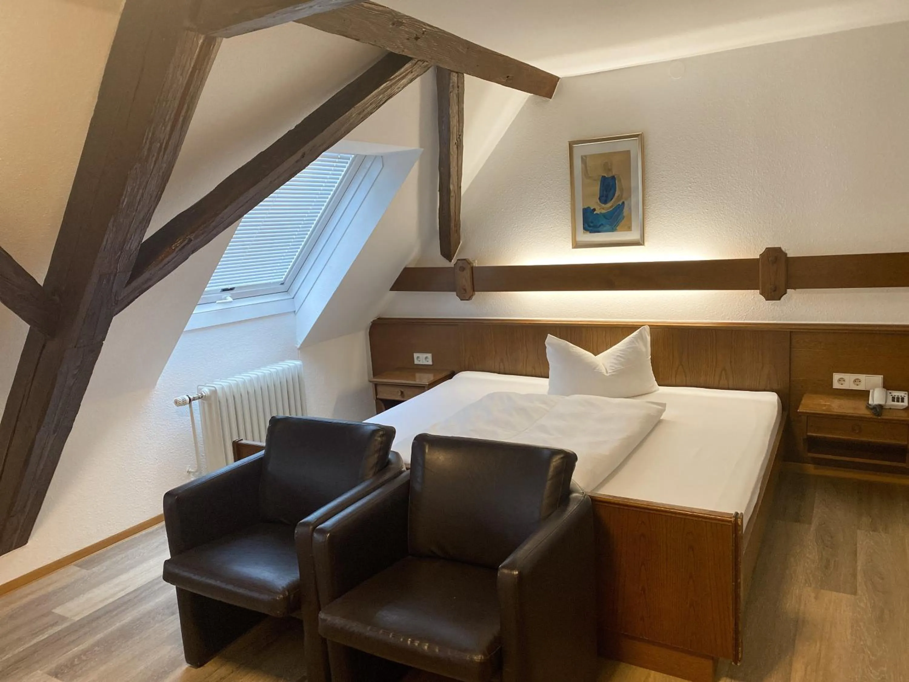 Photo of the whole room, Bed in Hotel Rosengarten Tuttlingen