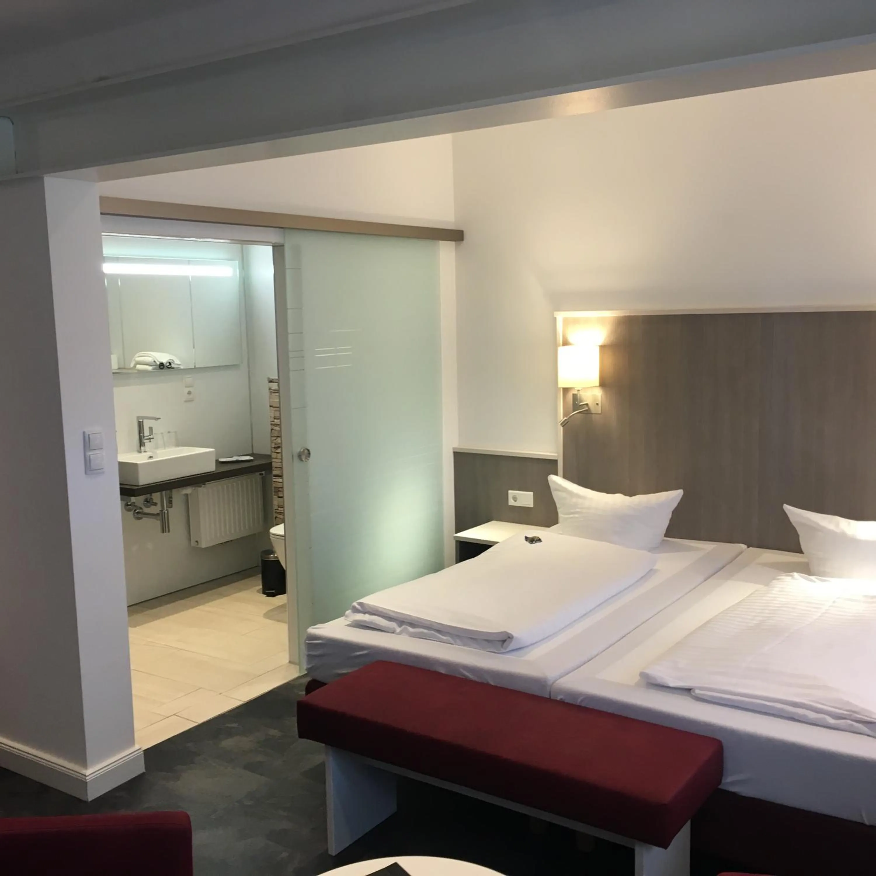 Photo of the whole room, Bed in WH Hotels Papenburg Zentrum