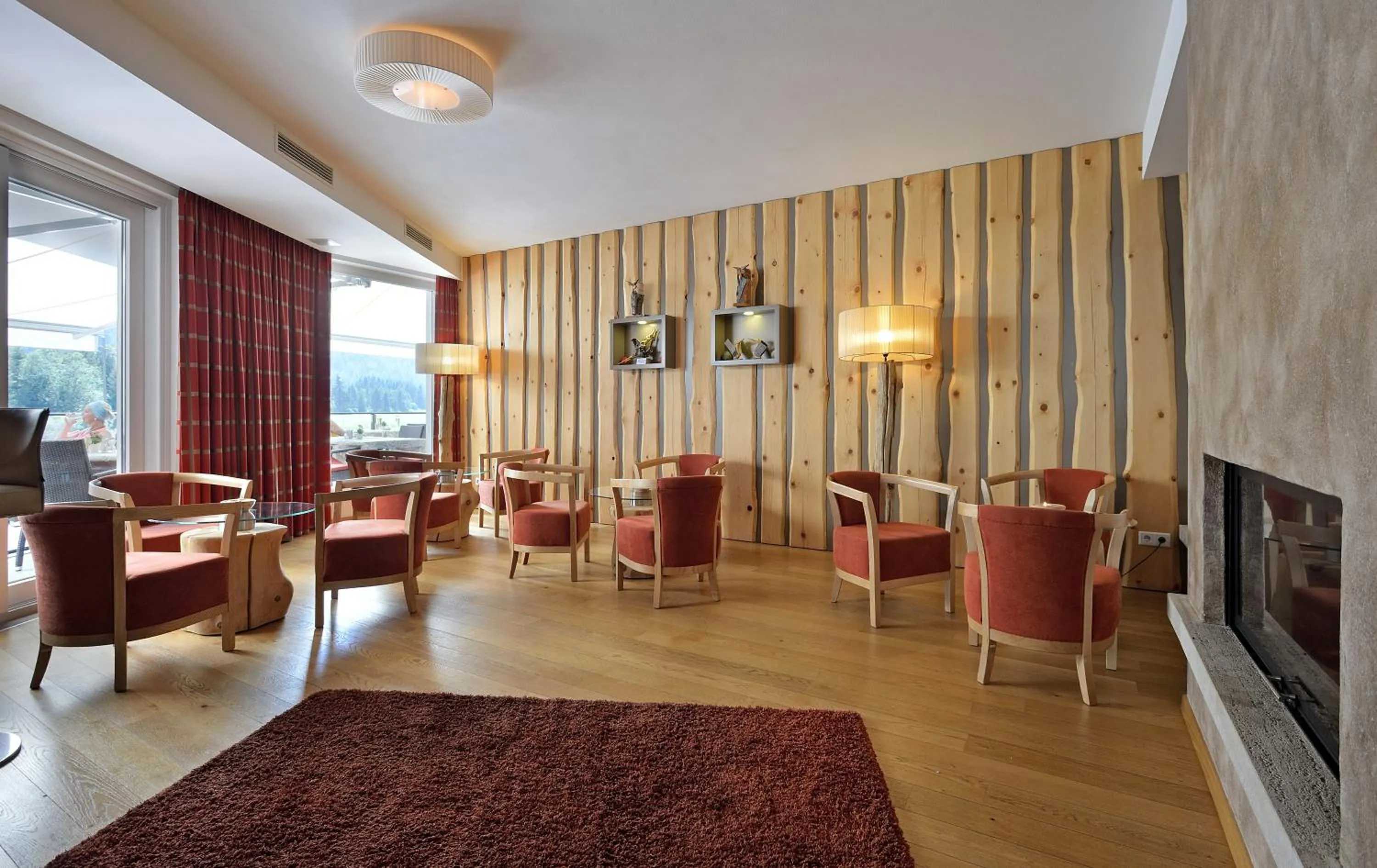 Communal lounge/ TV room in Naturhotel Tandler
