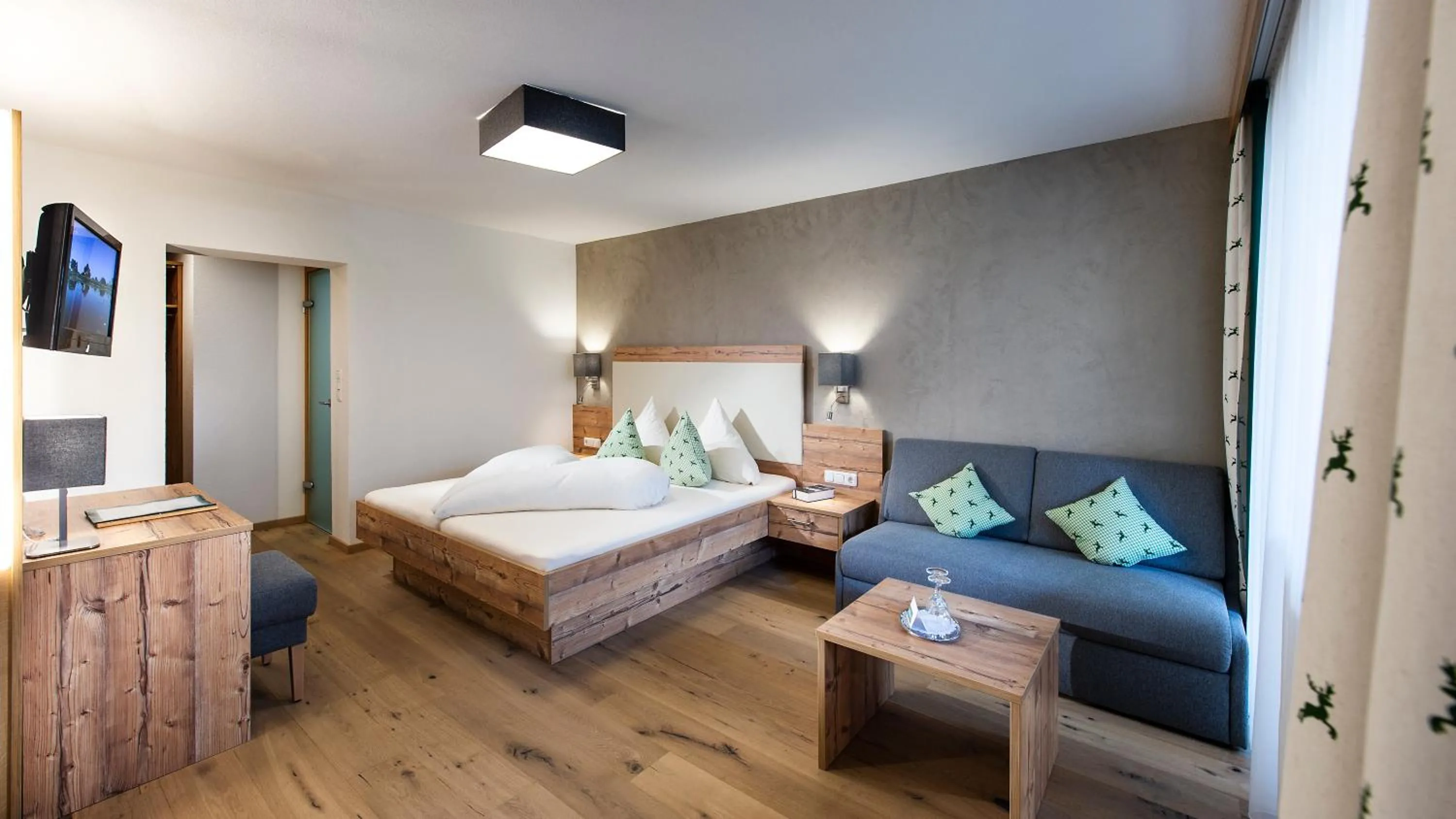 Seating area, Bed in Hotel Hubertushof