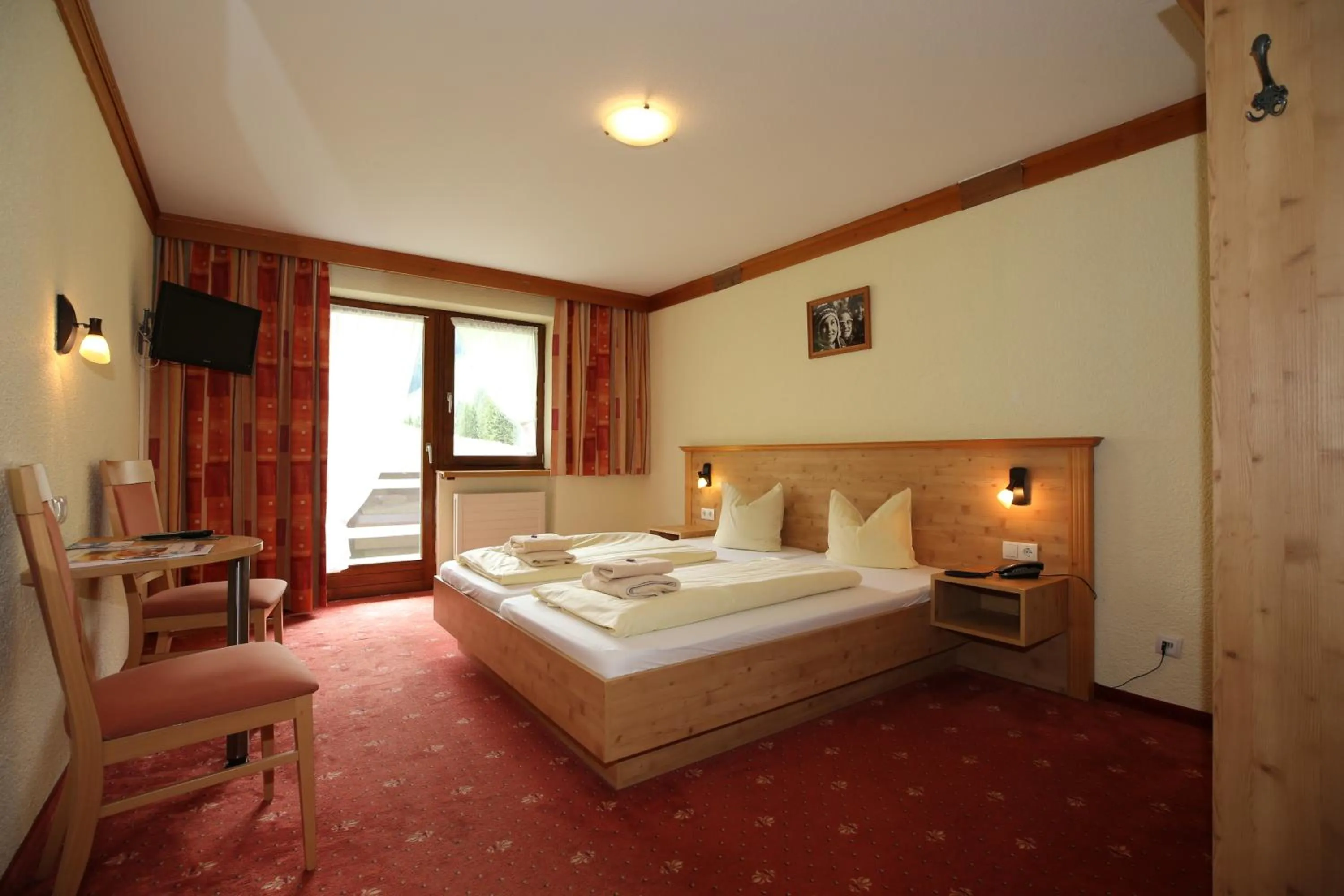 Bed in T3 Alpenhotel Garfrescha