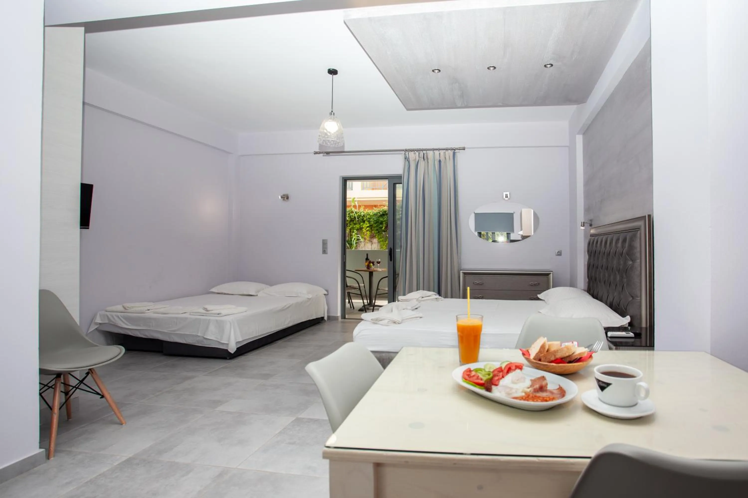 Dining area, Bed in Gold Apartments
