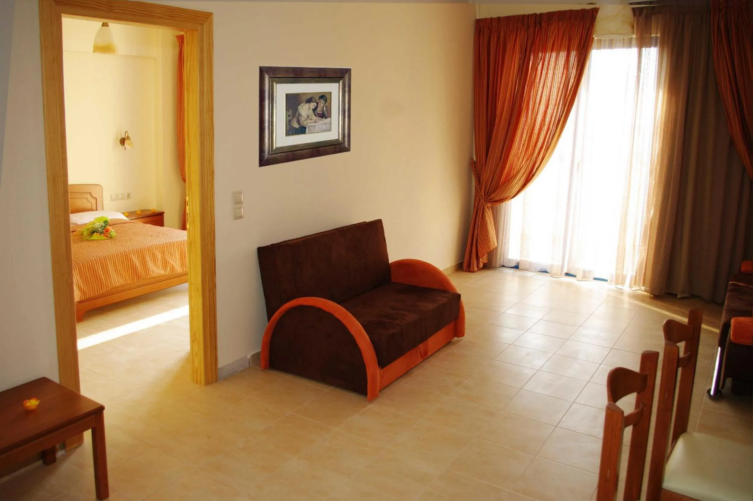 Seating area, Bed in Gold Apartments