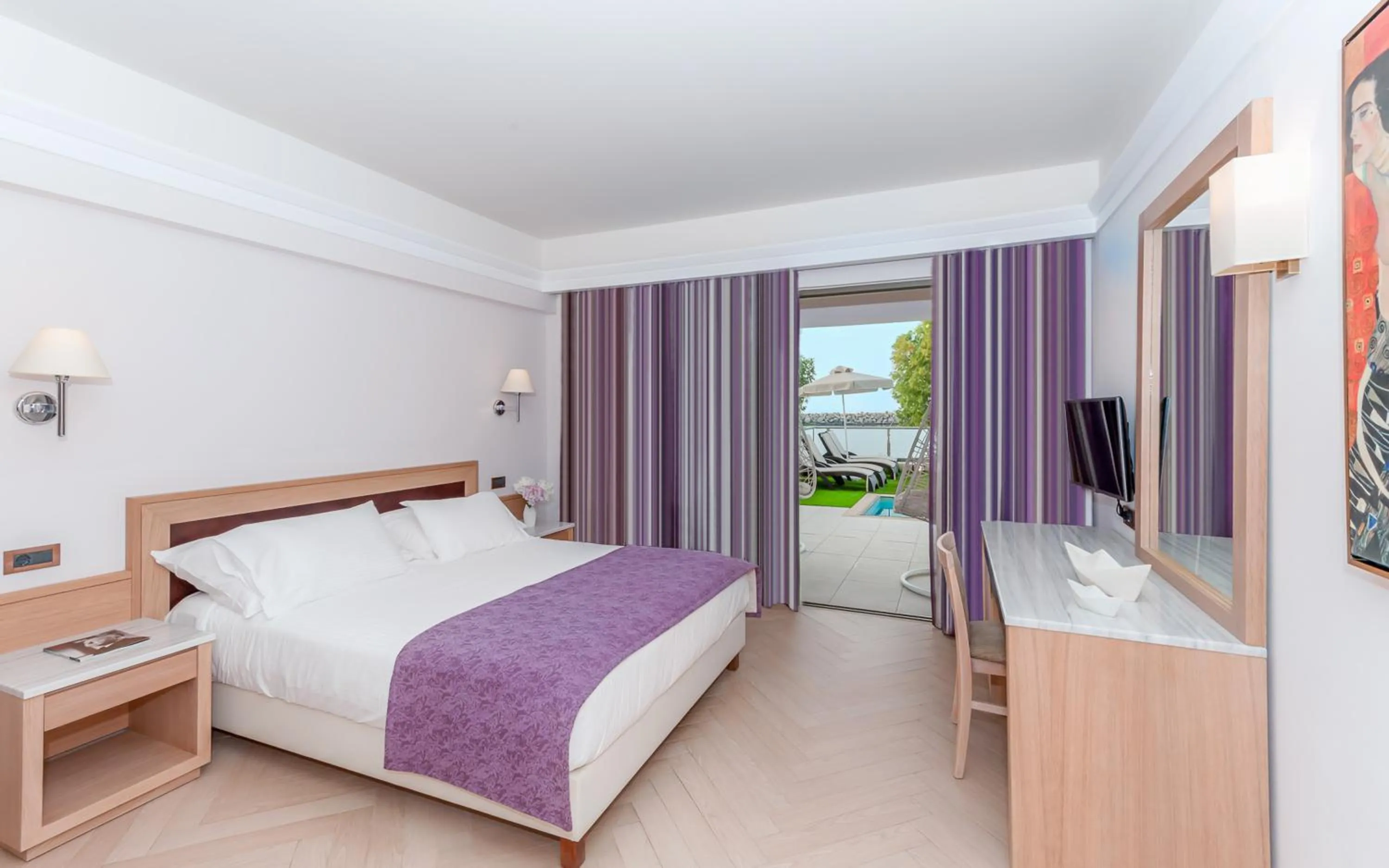 Photo of the whole room, Bed in Porto Platanias Beach Resort & Spa