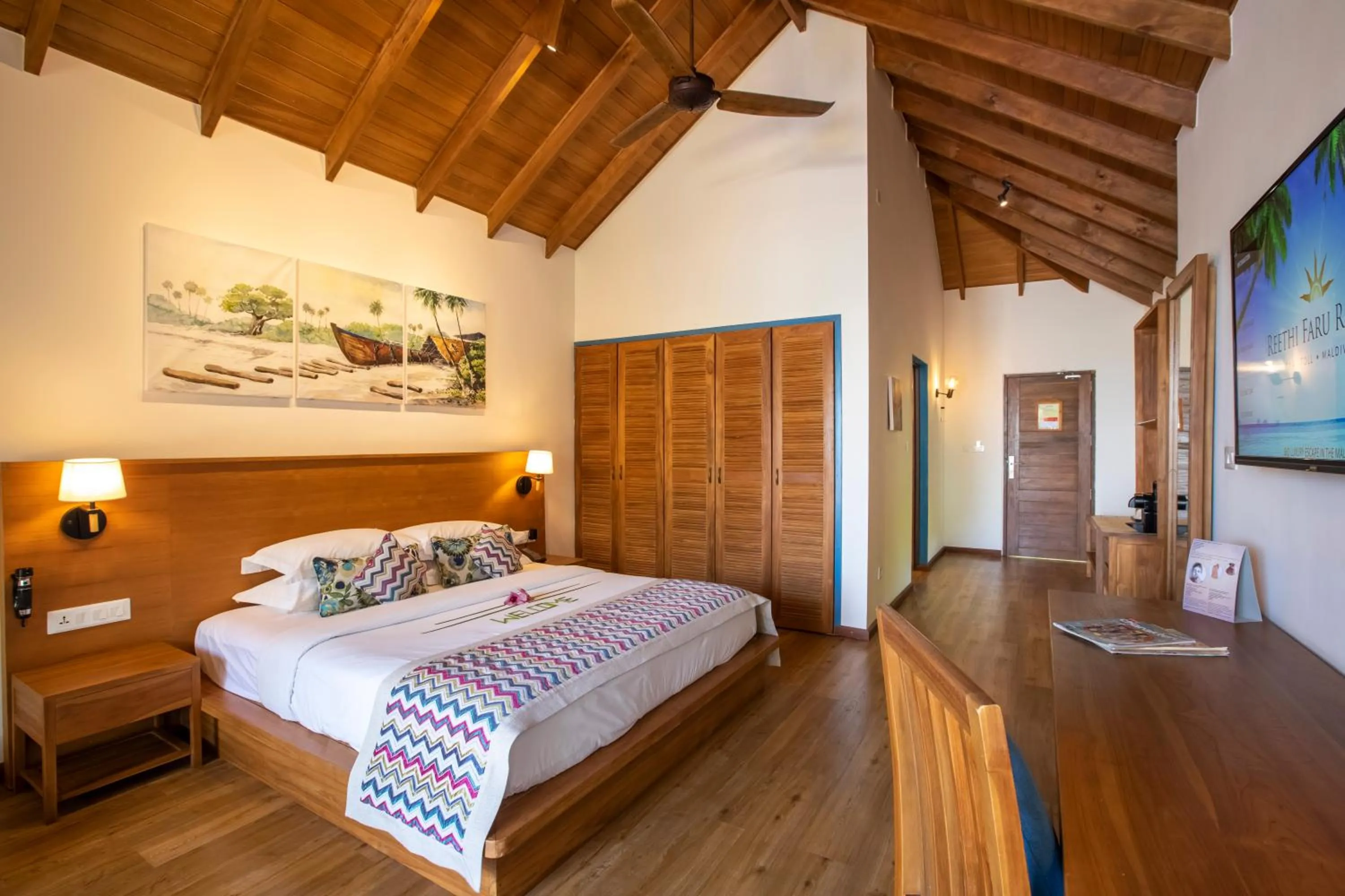 Bed in Reethi Faru Resort