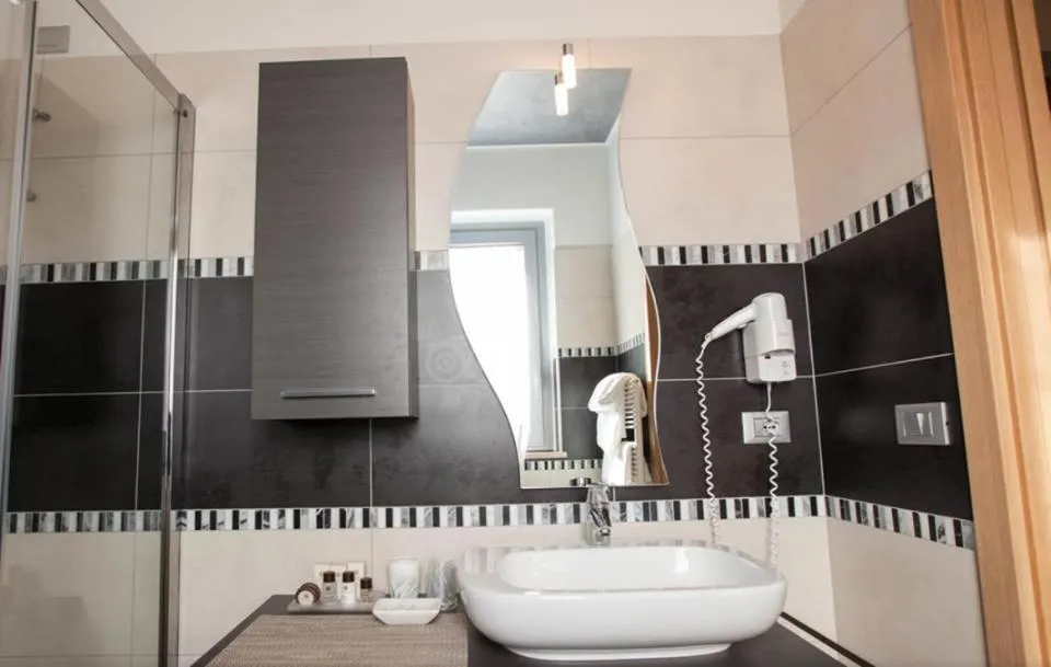 Bathroom in La Grotta Hotel