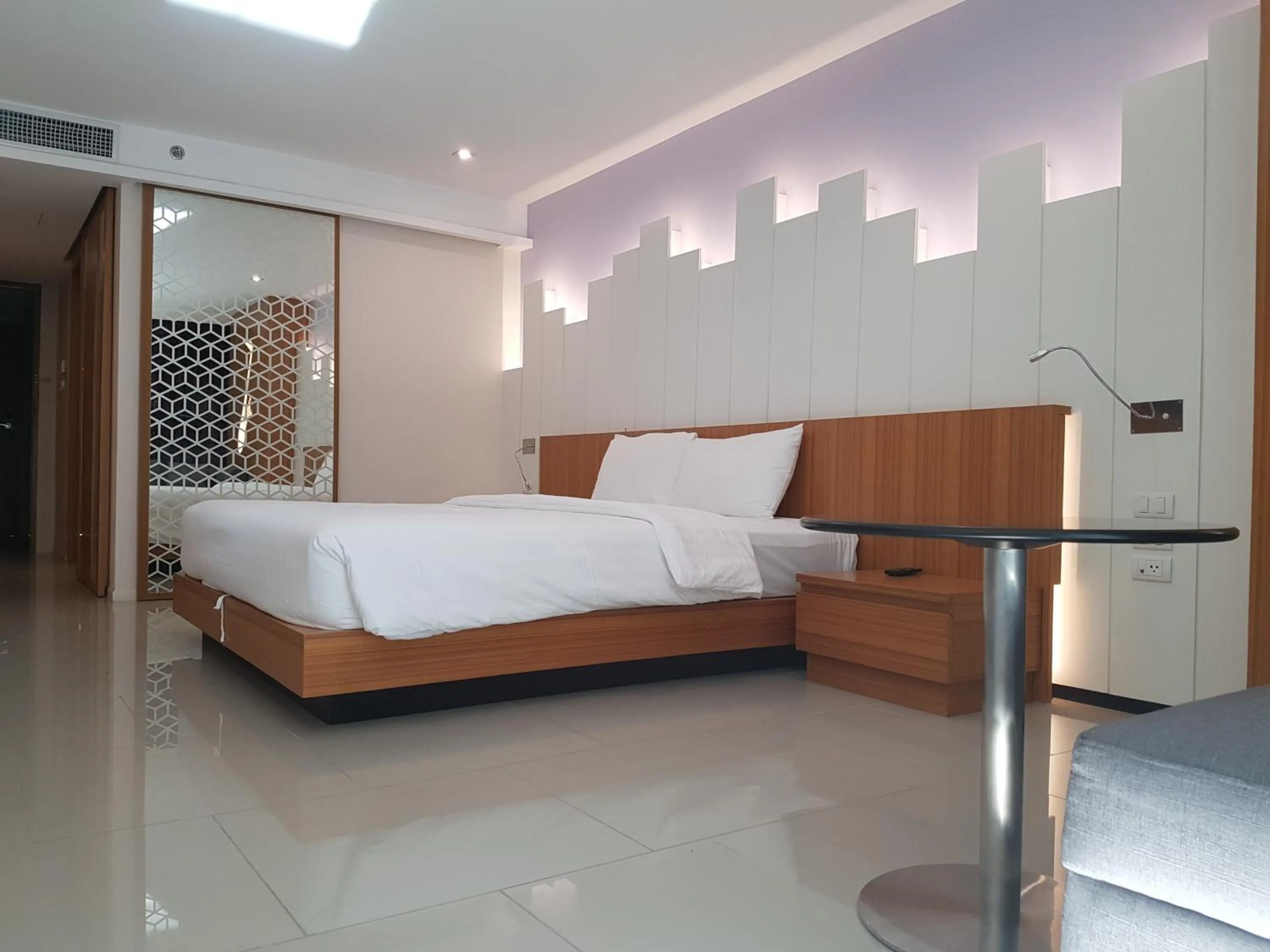 Bed in The Whisper Hotel