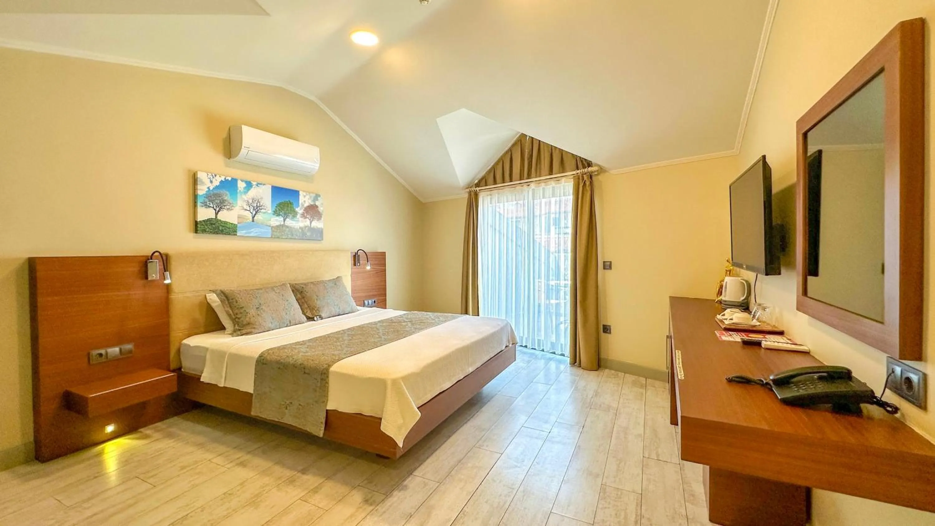 Communal lounge/ TV room, Bed in Göcek Centre Hotel