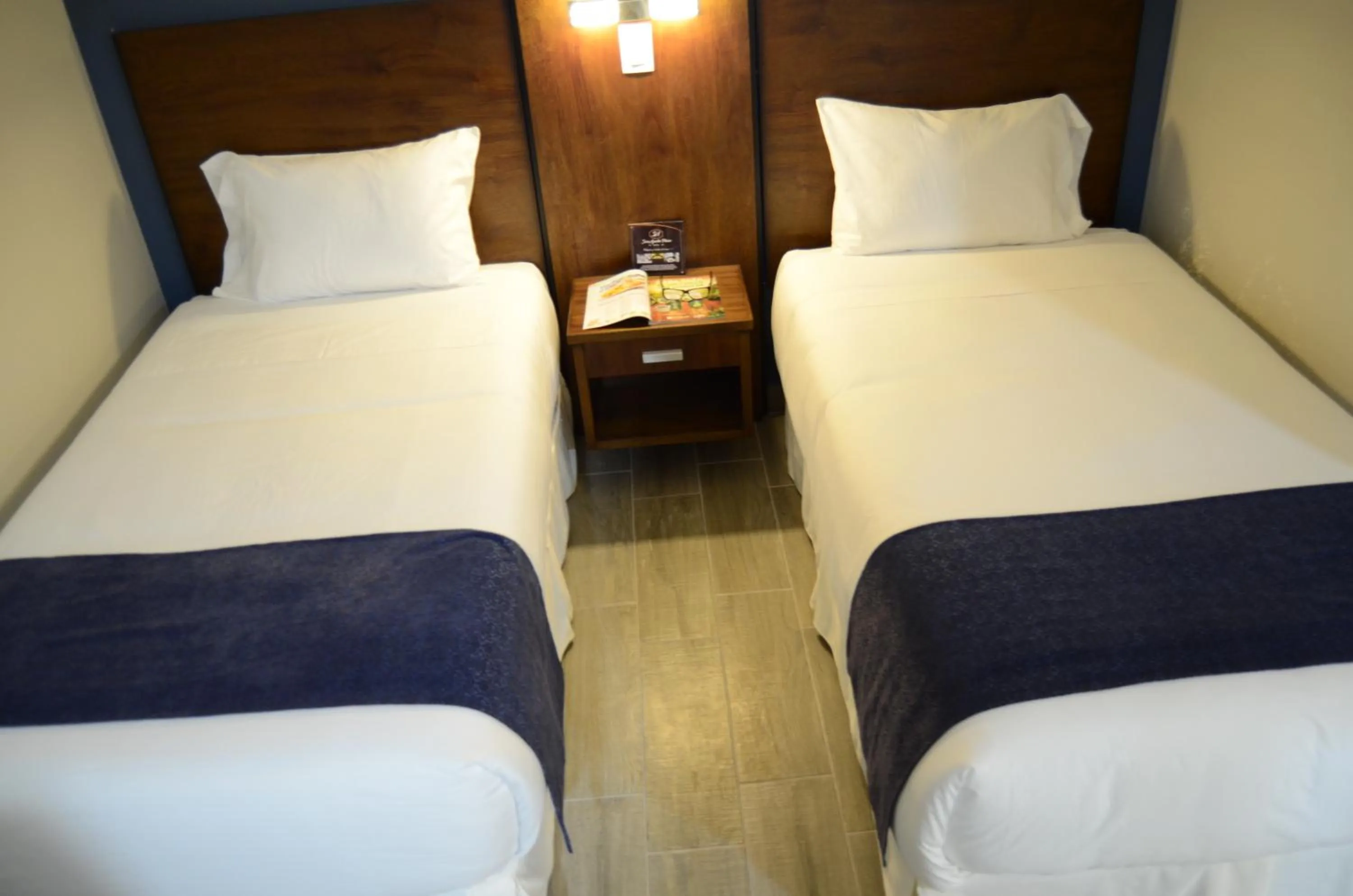 Bed in Hotel San Agustin Plaza