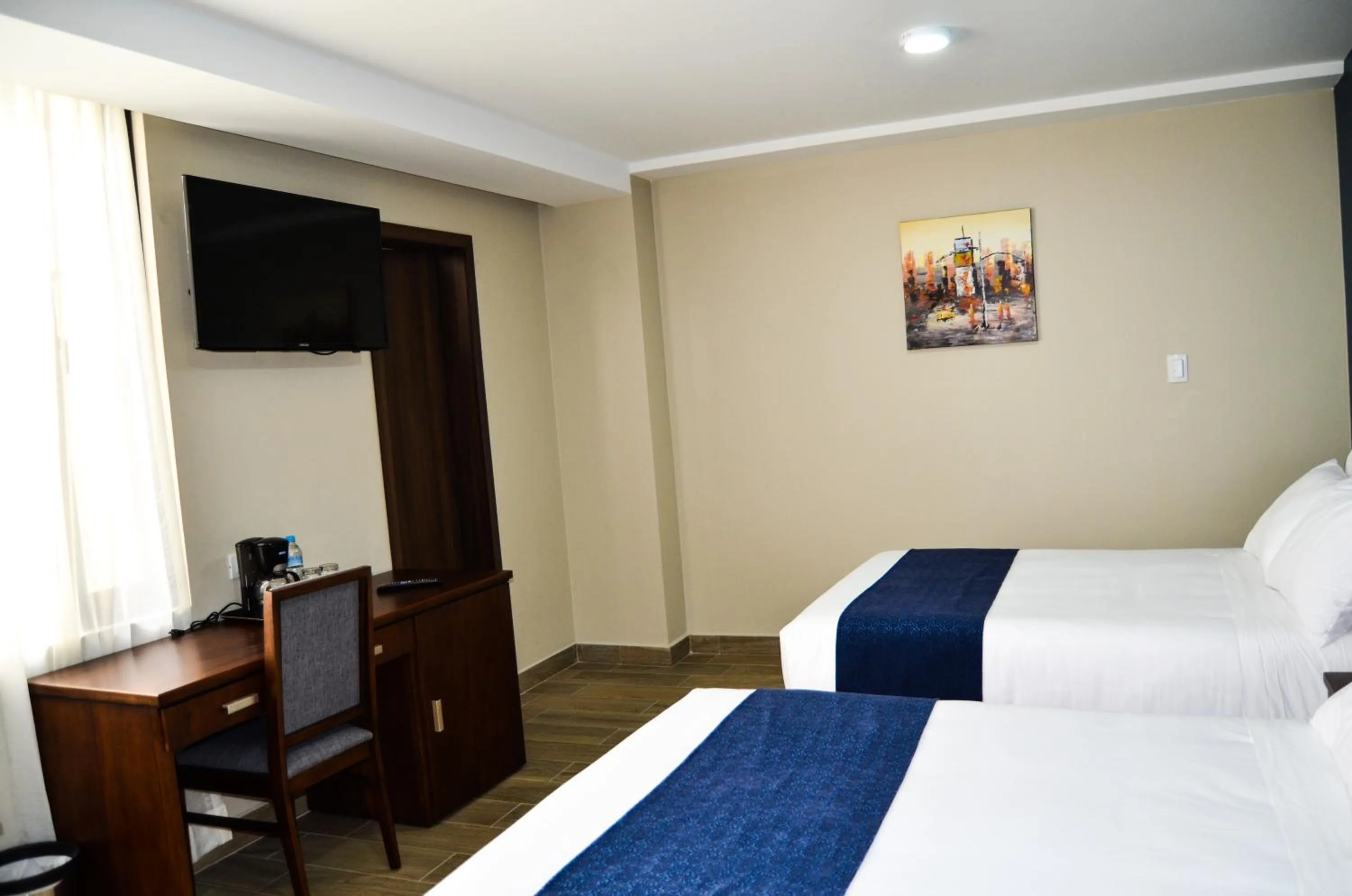 Bed in Hotel San Agustin Plaza